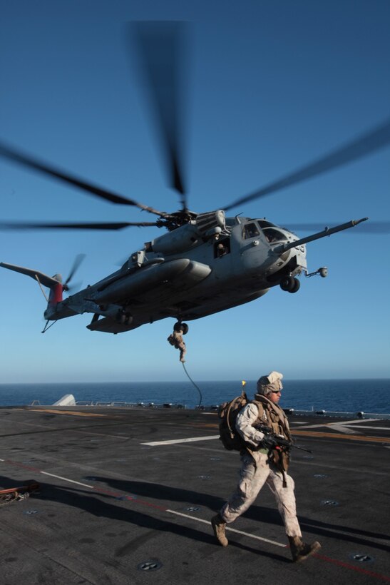 130620-M-OH054-308
PACIFIC OCEAN ABOARD USS BOXER (LHD-4) – Marines with Tactical Recovery of Aircraft and Personnel Platoon, Charlie Company, Battalion Landing Team 1/4, 13th Marine Expeditionary Unit, conduct fast rope training out of a CH-53E “Super Stallion” belonging to Marine Medium Tiltrotor Squadron 166 (Reinforced), during PHIBRON-MEU Integration aboard the USS Boxer (LHD-4), June 20, 2013. PMINT is a three week long pre-deployment training event focusing on the combined Marine Expeditionary Unit and Amphibious Ready Group capabilities and the strengthening of the Navy and Marine Corps team. (Official U.S. Marine Corps photo by Sgt. Christopher O’Quin/Released)