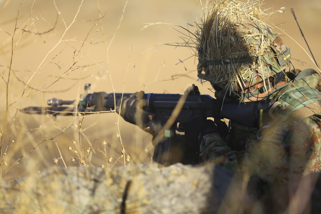 Japanese Ground Self-Defense Force soldiers participate in a live-fire and movement range as part of exercise Dawn Blitz. The live-fire range implements small arms, recoiless rifle and mortar support to overtake a combat town objective. Dawn Blitz 2013 is a multinational amphibious exercise off the Southern California coast that refocuses Navy and Marine Corps and coalition forces in their ability to conduct complex amphibious operations essential for global crisis response across the range of military operations. (Photo by U.S. Marine Corps Cpl. Jonathan R. Waldman, 11TH MEU, Combat Camera/Released)