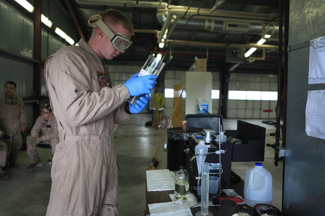 Cpl. Ryan Gutzmann, a fuel specialist with Marine Wing Support Squadron 471 and a native of Minnesota, tests aircraft fuel for sediments and impurities during Exercise Maple Flag 46, June 11. Maple Flag is an annual, multinational, air-combat training exercise that trains participating forces together as large coalition forces. (U.S. Marine Corps photo by Lance Cpl. Tiffany Edwards/Released)
