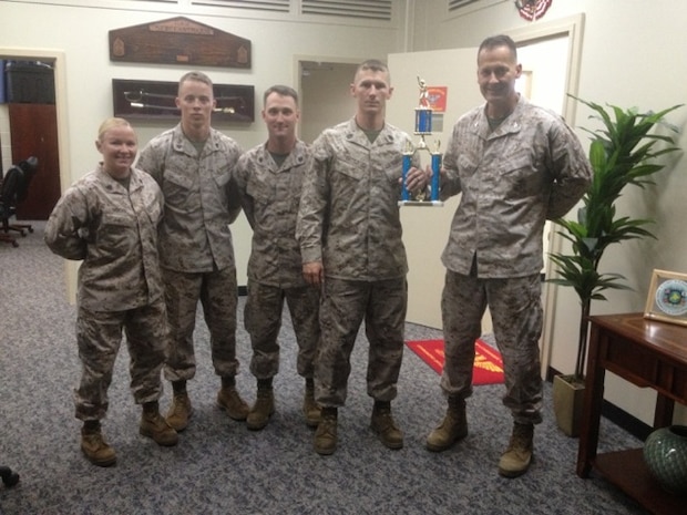 Colonel Kasperski, Combat Logistics Regiment 37 Commanding Officer, is presented with the second place softball trophy for the Southern Camp Commanders Cup.  The CLR-37 softball team competed against eight other units throughout the two day tournament aboard Camp Foster.  CLR-37 went on to place third in the Commanding General's Cup.


