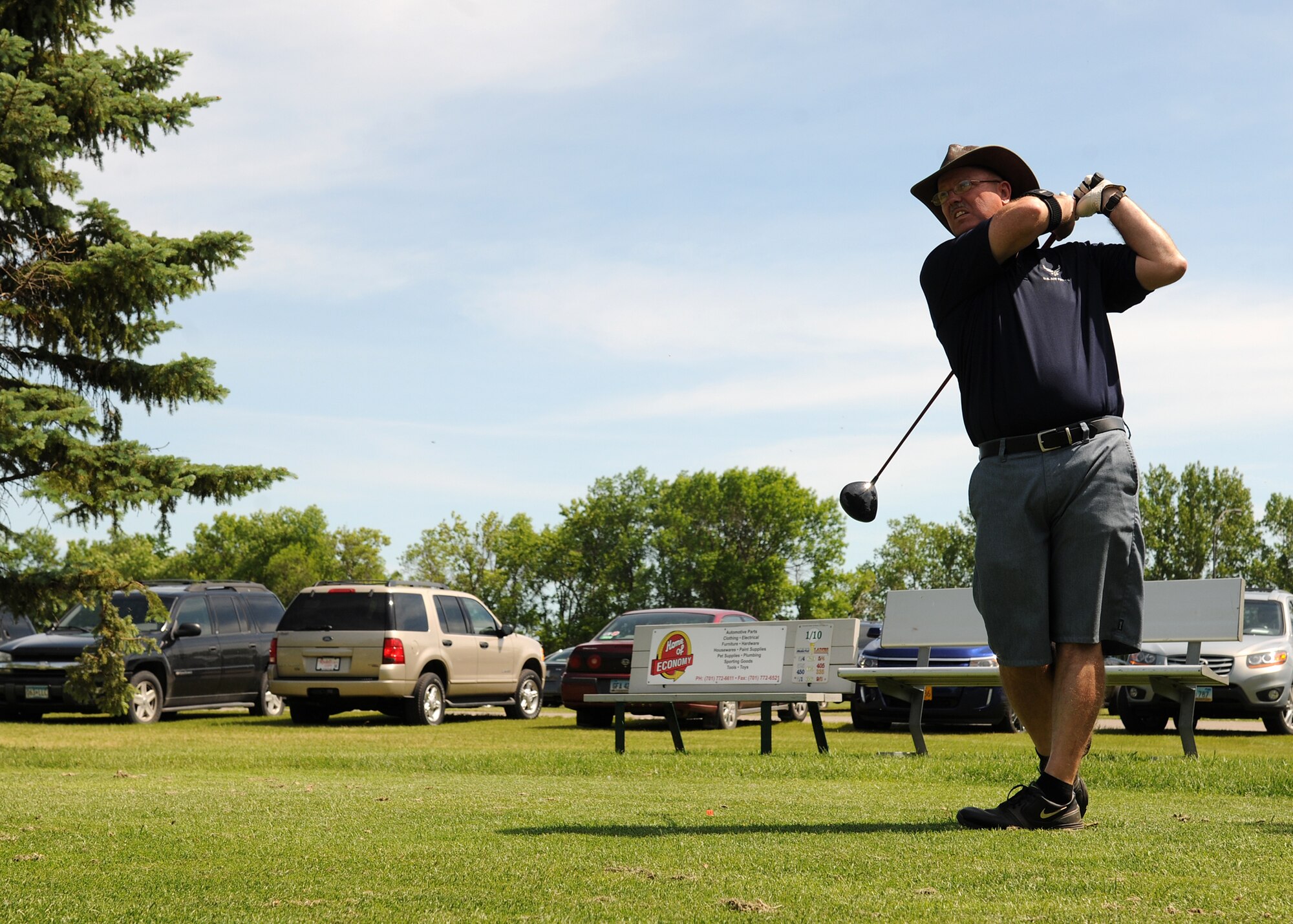 Chief Master Sgt. David Duncan, 319th Air Base Wing command chief, tees off at the first hole of the Military Affairs Committee golf tournament on June 24, 2013, at the Plainsview Golf Course on Grand Forks Air Force Base, N.D. The MAC Golf Tournament is an annual event on base which brings civilians and military personnel together to build and strengthen community relations. (U.S. Air Force photo/Airman 1st Class Ashley Nicole Taylor)