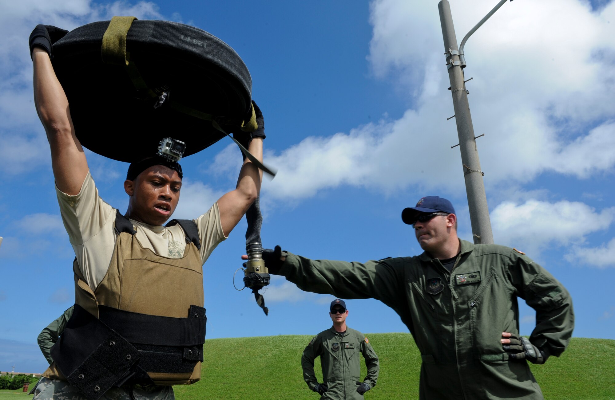 U.S. Air Force 1st Lt. Paul Stephens, 18th Logistics Readiness Squadron fuels management flight commander, holds a 100-meter hose during a forward area refueling point team try-out on Kadena Air Base, Japan, June 20, 2013. The physical portion of the try-out process is only a third of the process.  The participants must also complete a written test to find out their general knowledge of FARP, and an interview in front of the current FARP team members. (U.S. Air Force photo by Airman 1st Class Justin Veazie/Released) 