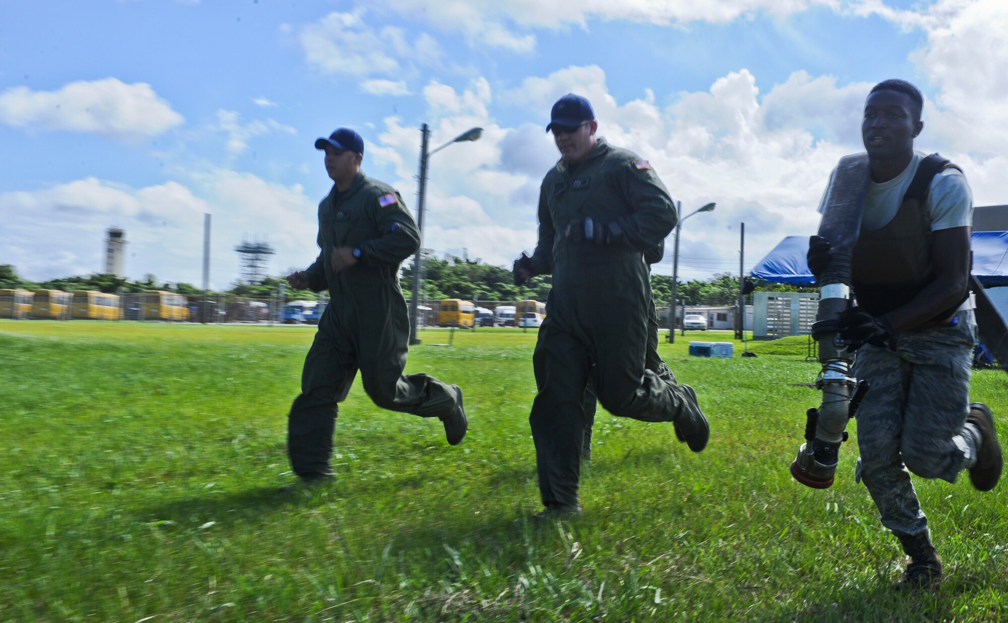 U.S. Air Force Airman 1st Class Brandon Avery, 18th Logistics Readiness Squadron fuels distribution operator, runs with a hose during a forward area refueling point team try-out on Kadena Air Base, Japan, June 20, 2013. Kadena’s try-out process for the FARP team is the most physically demanding try-out between the five bases; these bases include Kadena Air Base, Japan; RAF Mildenhall, England; Hurlburt Field, Fla.; Charleston Air Force Base, S.C.; and Cannon Air Force Base, N.M. (U.S. Air Force photo by Airman 1st Class Justin Veazie/Released) 