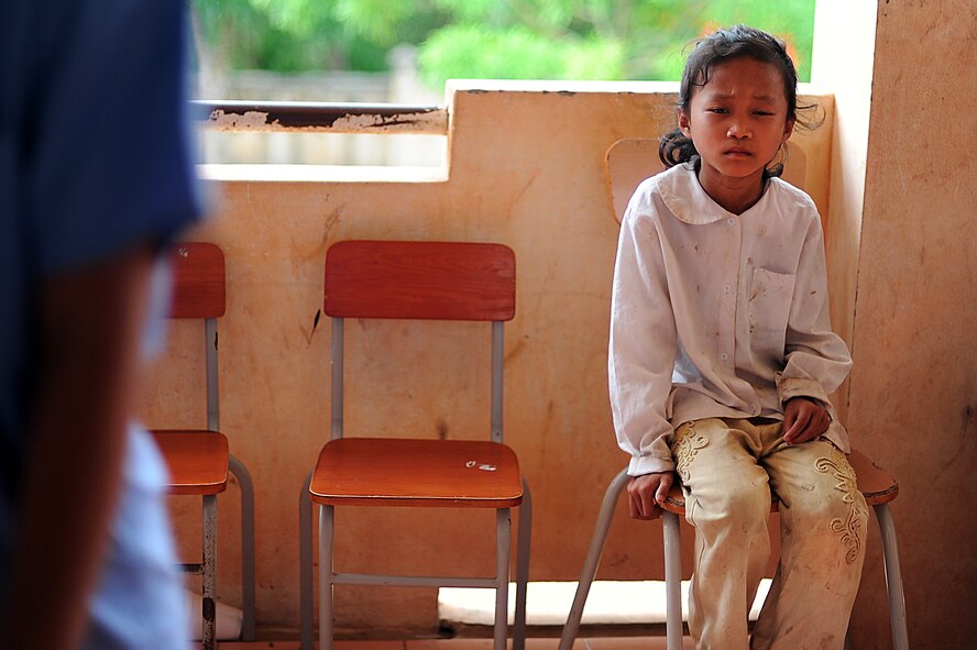 A Vietnamese child squints as she tries to get a look into the interim
optometry clinic before she is seen by eye specialists from the U.S.
military and Vietnam People's Armed Forces during Operation Pacific Angel
2013 in Dong Hoi, Quang Binh Province, Vietnam, June 10, 2013. Optometry Is
one of the various medical services that are offered as part of the Health
Services Outreach program during the reoccurring humanitarian mission.
Operation PACANGEL is a joint and combined humanitarian assistance exercise
held in various countries several times a year and includes medical, dental,
optometry, engineering programs and a variety of subject-matter expert
exchanges. (U.S. Air Force photo by Staff Sgt. Sara Csurilla)
