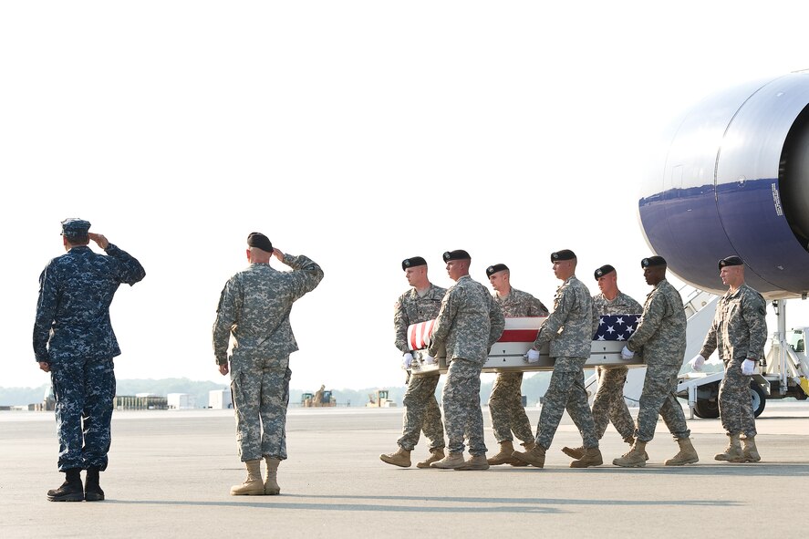 A U.S. Army carry team transfers the remains of Army Spc. Javier Sanchez Jr. of Greenfield, Calif., June 25, 2013 at Dover Air Force Base, Del. Sanchez was assigned to the Special Troops Battalion, 2nd Brigade Combat Team, 10th Mountain Division, Fort Drum, N.Y. (U.S. Air Force photo/Roland Balik)