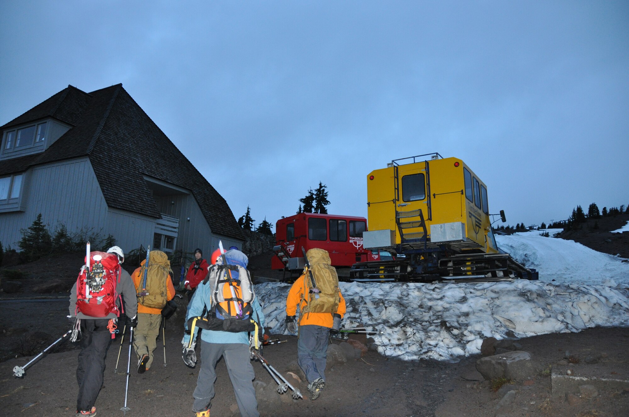 304th Rescue Squadron pararescueman?along with civilian rescue searchers?prepare to board a snow-cat to travel to the top of Mount Hood and begin searching for Kinley Adams, 59, who went missing Saturday. Pararescuemen are the only members of the DoD specifically organized, trained and equipped to conduct personnel recovery operations in hostile or denied areas as a primary mission. (U.S. Air Force Photo/Staff Sgt. N. Daniel Delgado)