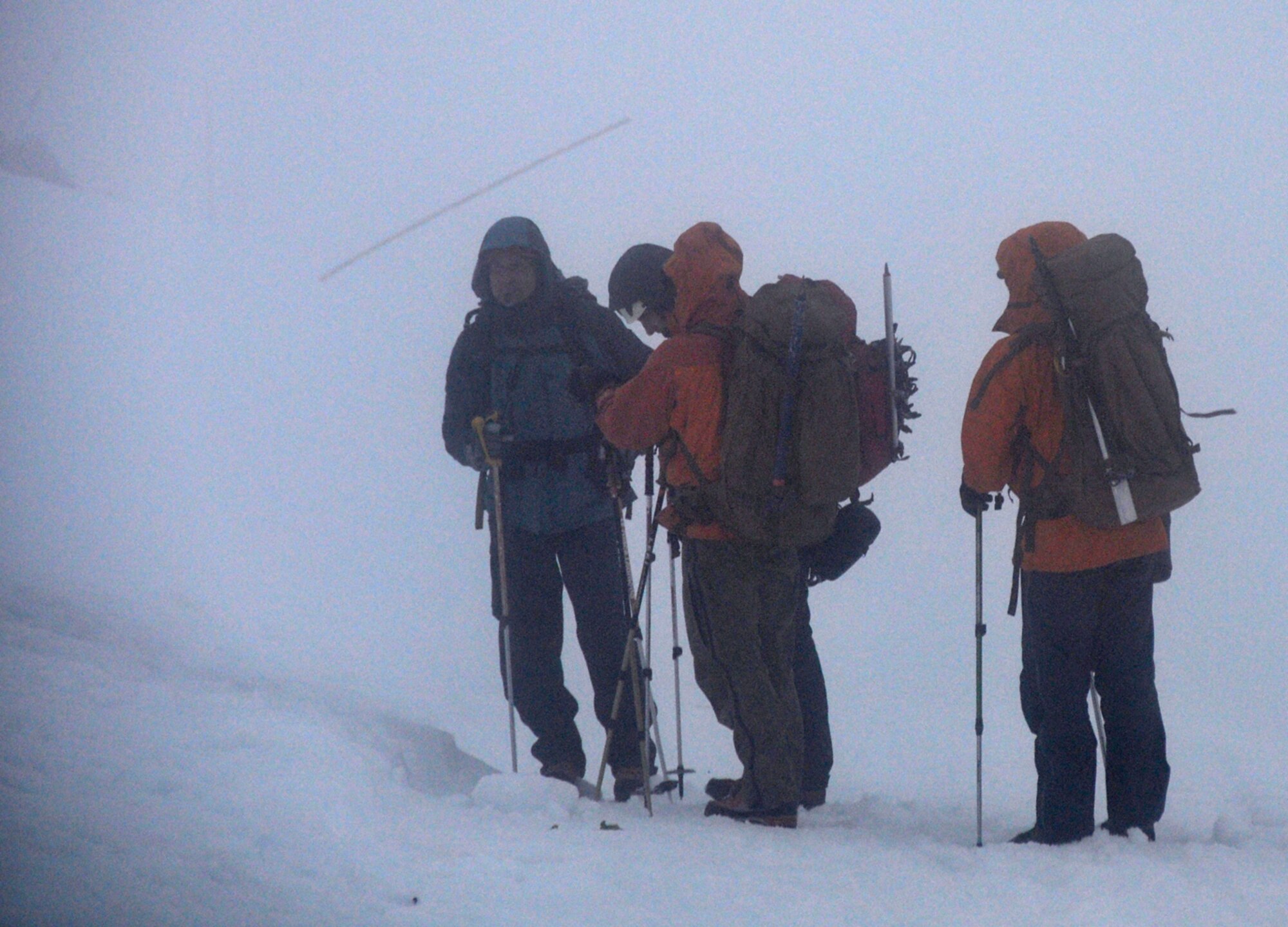 Pararescuemen from the 304th Rescue Squadron, Portland, Ore. and civilian rescue searchers begin searching on Mount Hood for Kinley Adams, 59, who went missing Saturday on Mount Hood. Reserve pararescuemen from the 304th RQS work hand-in-hand with local rescue agencies to search for the missing dentist from Salem, Ore. Pararescuemen are the only members of the DoD specifically organized, trained and equipped to conduct personnel recovery operations in hostile or denied areas as a primary mission. (U.S. Air Force Photo/Staff Sgt. N. Daniel Delgado)