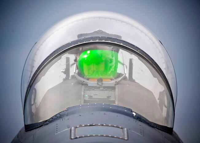 Capt. Eric Joachim, 335th Fighter Squadron standard and evaluation pilot, Seymour Johnson Air Force Base, N.C., conducts pre-flight checks during Green Flag-West 13-5 June 24, 2013, at Nellis Air Force Base, Nev. The mission of the 335th FS is to be prepared to deploy anywhere in the world on short notice and deliver an array of air-to-ground weapons with pinpoint accuracy. (U.S. Air Force photo/Senior Airman Brett Clashman)
