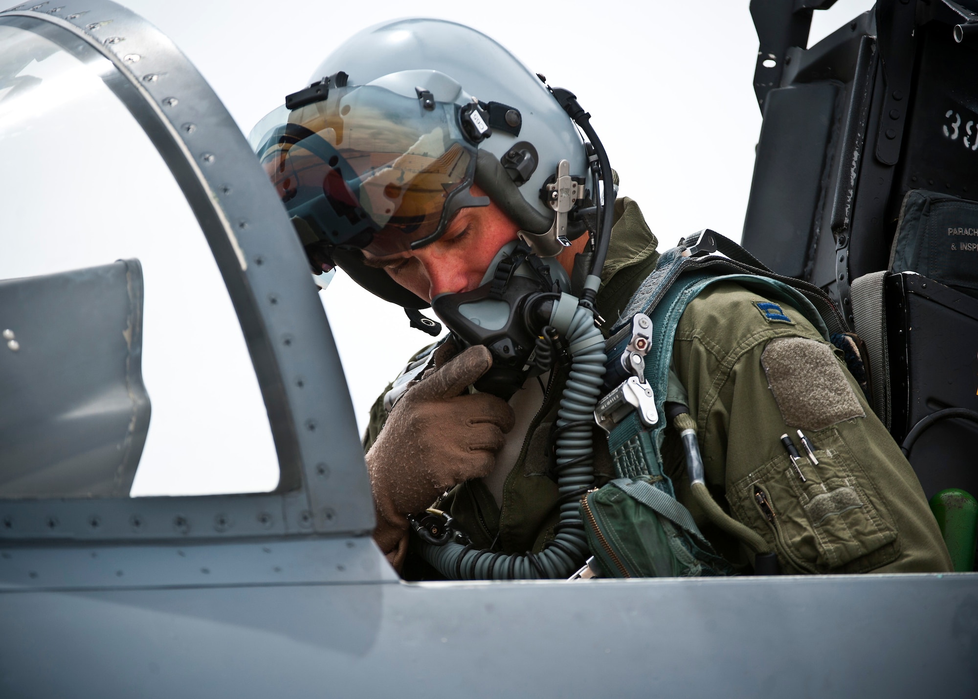 Capt. Eric Joachim, 335th Fighter Squadron standard and evaluation pilot, Seymour Johnson Air Force Base, N.C., conducts pre-flight checks during Green Flag-West 13-5 June 24, 2013, at Nellis Air Force Base, Nev. Green Flag-West is a realistic air-land integration combat training exercise held at U.S. Army Combat Training Center at Ft. Irwin, Calif. (U.S. Air Force photo/Senior Airman Brett Clashman)