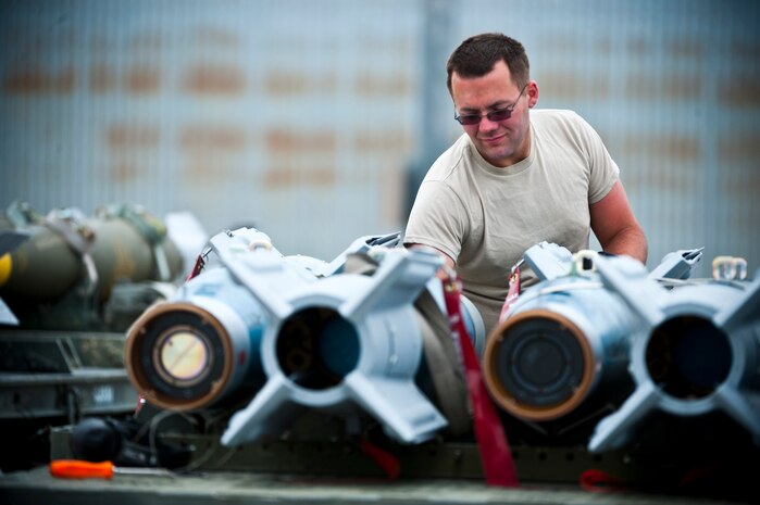 Airman 1st Class James Haddock, 4th Aircraft Maintenance Squadron aircraft armament systems apprentice, Seymour Johnson Air Force Base, N.C., checks the wiring pins of a GBU-12 inert bomb during Green Flag-West 13-5 June 24, 2013, at Nellis Air Force Base, Nev. Green Flag-West provides a realistic close-air support training environment for Airmen and soldiers preparing to deploy in support of combat operations. (U.S. Air Force photo/Senior Airman Brett Clashman)