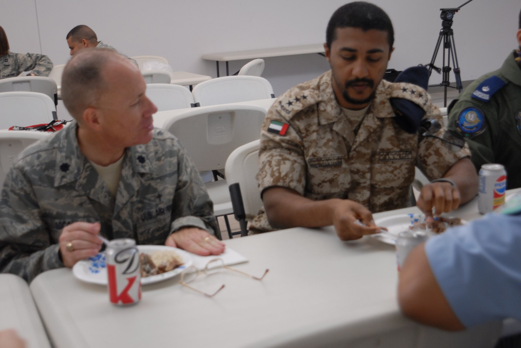 GOODFELLOW AIR FORCE BASE, Texas – 17th Training Wing Chaplin, Lt. Col. Stephen Nicolai, and an international student talk while having lunch during the International Student Brown Bag Luncheon, June 18, at the base chapel. The purpose of the luncheon is to give Team Goodfellow the chance to learn about the international student officers on base. (U.S. Air Force photo/ Airman 1st Class Breonna Veal)