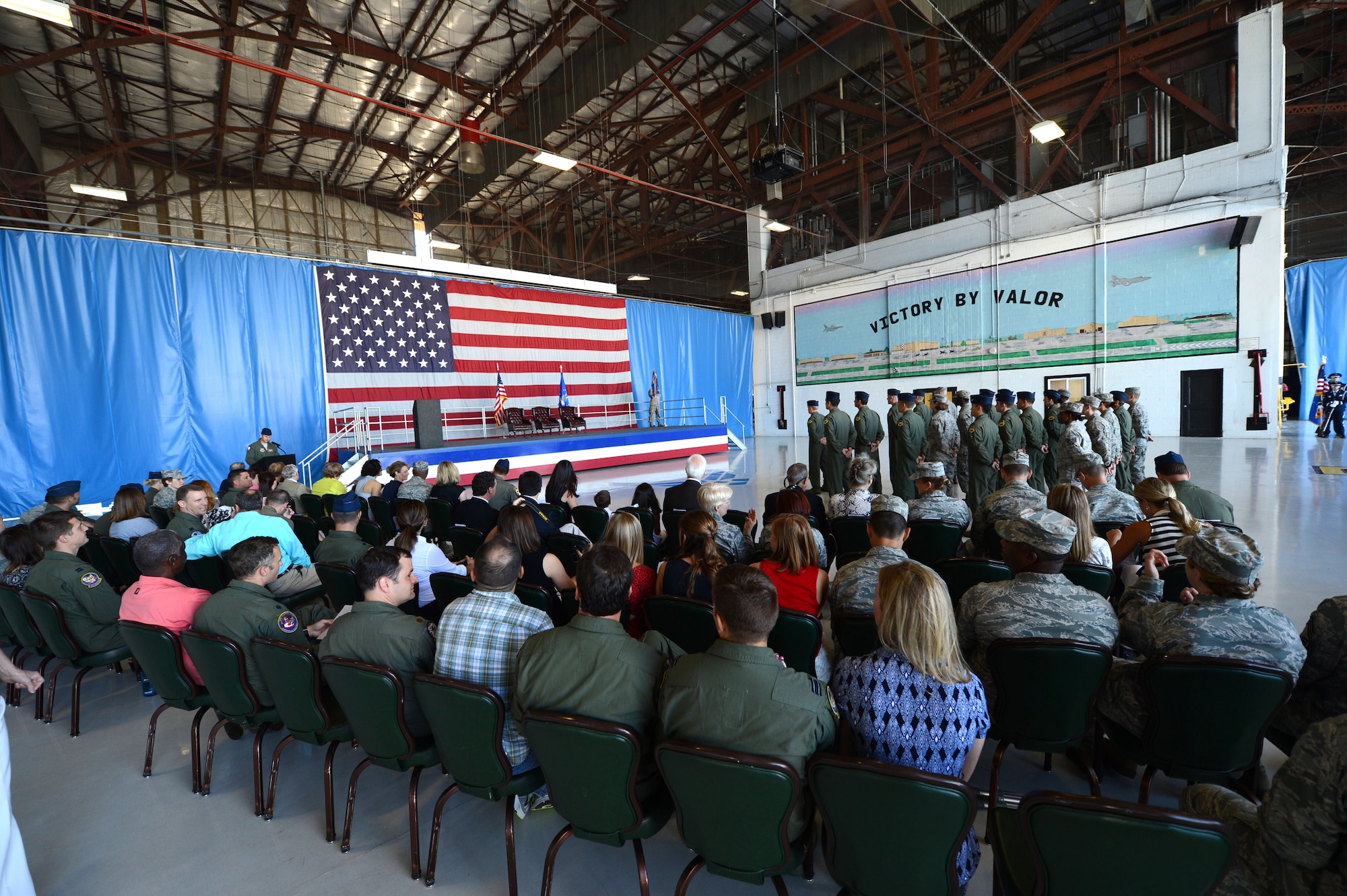 U.S. Air Force Airmen and family members gather at the 77th Fighter Squadron change of command, Shaw Air Force Base, S.C., June 21, 2013.  Lt. Col. John Vargas was succeeded in command by Lt. Col. Matthew Ayres. (U.S. Air Force photo by Airman 1st Class Nicole Sikorski/Released).  