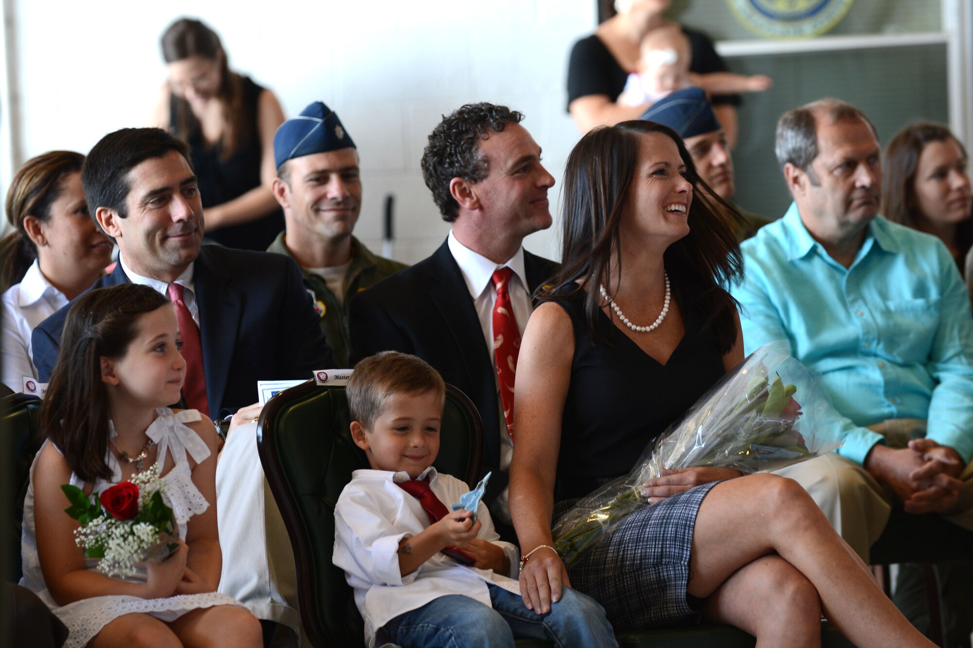 Family members of U.S. Air Force Lt. Col. John Vargas, former 77th Fighter Squadron commander, sit in the crowd at the 77th FS change of command, Shaw Air Force Base, S.C., June 21, 2013.  Vargas was succeeded in command by Lt. Col. Matthew Ayres. (U.S. Air Force photo by Airman 1st Class Nicole Sikorski/Released).  
