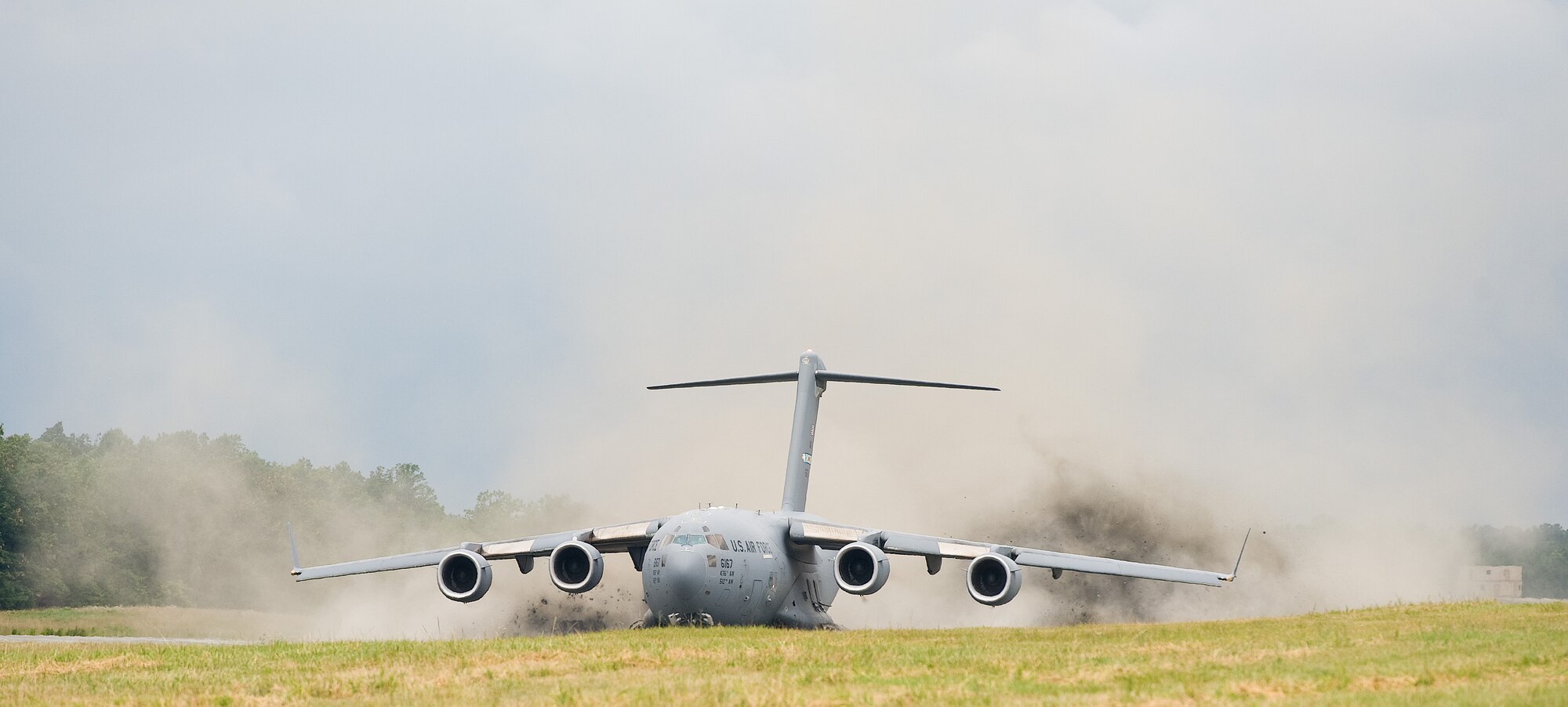 A C-17A Globemaster III flown by an aircrew from the 3rd Airlift Squadron, Dover Air Force Base, Del., powers up  on its take off June 19, 2013 at Fort A.P. Hill, Va. The aircrew accomplished semi-prepared runway operations consisting of take offs and landings simulating real world austere airfields. (U.S. Air Force photo/Roland Balik)