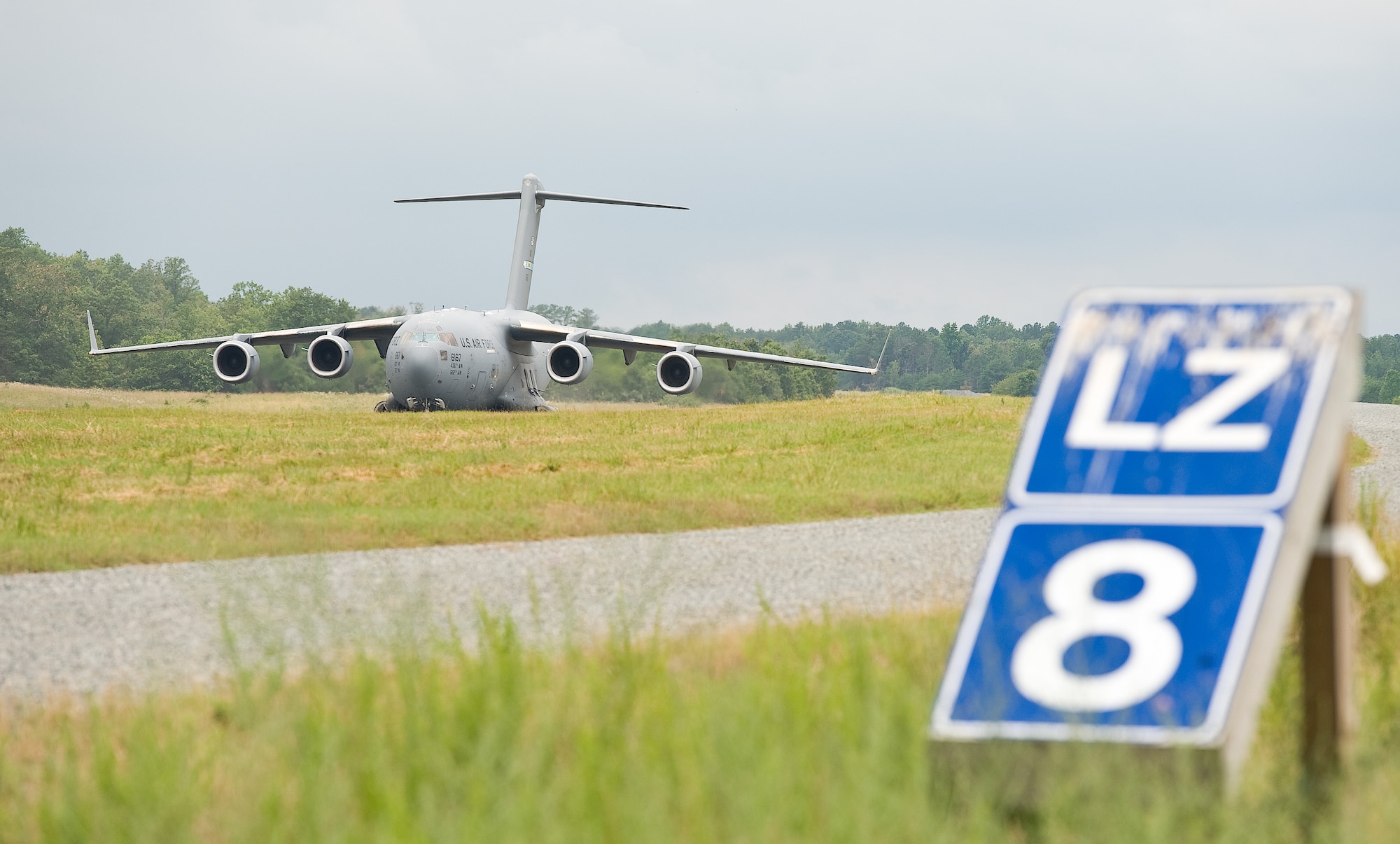 A C-17A Globemaster III assigned to the 436th Airlift Wing, Dover Air Force Base, Del., prepares to take off June 19, 2013 at Fort A.P. Hill, Va. An aircrew from the 3rd Airlift Squadron, Dover AFB, practiced semi-prepared runway operations in conjunction with units assigned to the 621st Contingency Response Wing, Joint Base McGuire-Dix-Lakehurst, N.J. (U.S. Air Force photo/Roland Balik)