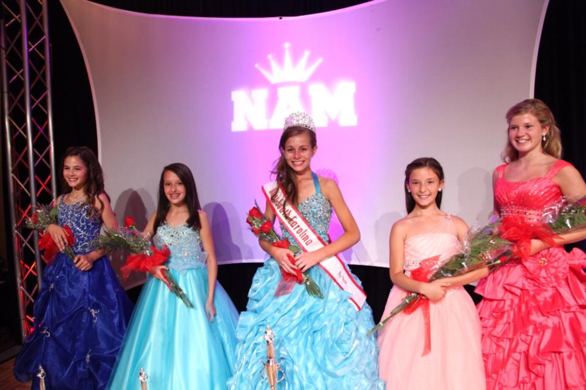 Alexandra Tiek, daughter of Chief Master Sgt. Jason Tiek, 20th Aircraft Maintenance Squadron, Tiger Aircraft Maintenance Unit superintendent and Senior Master Sgt. Lenora Tiek 20th Communications Squadron, earns the prestigious title Miss South Carolina Pre-teen  during the 2013 South Carolina National American Miss Pageant the at Columbia, S.C., June 14 and 15. Alexandra also received top honors for photogenic and most promising model in her division.  (Courtesy photo) 