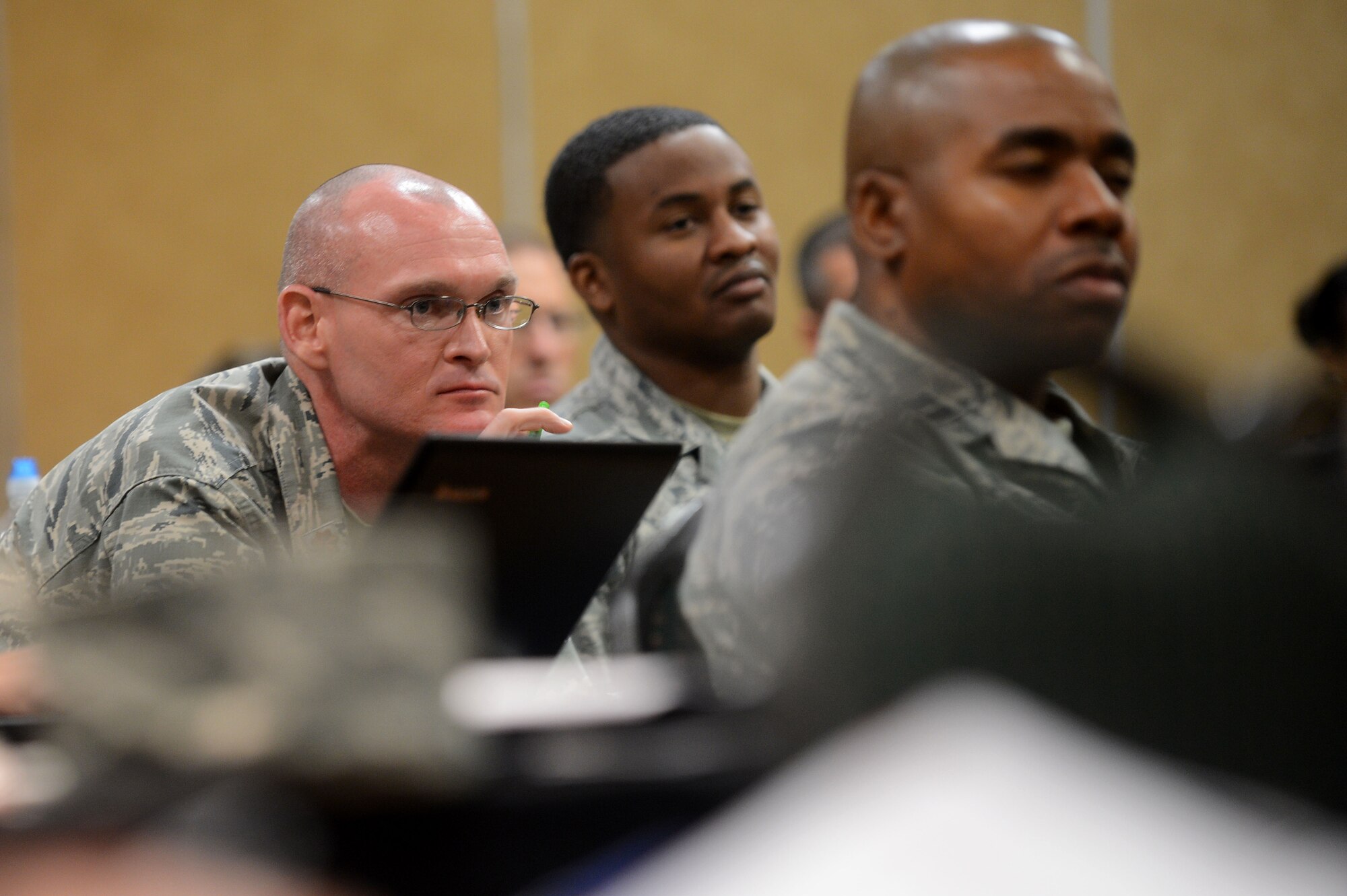 U.S. Air Force Maj. Eric Boyer, Joint-base McGuire deputy wing chaplain listens to Airmen speak at a chaplain symposium, Columbia, S.C., June 18, 2013.  They discussed how to prepare to meet the spiritual needs of Airmen and other service members down range.  Four Airmen from the 20th Civil Engineer Squadron explosive ordnance disposal at Shaw spoke at the symposium about combat deployments and the vital role that chaplains had played for them.  (U.S. Air Force photo by Airman Nicole Sikorski/Released)