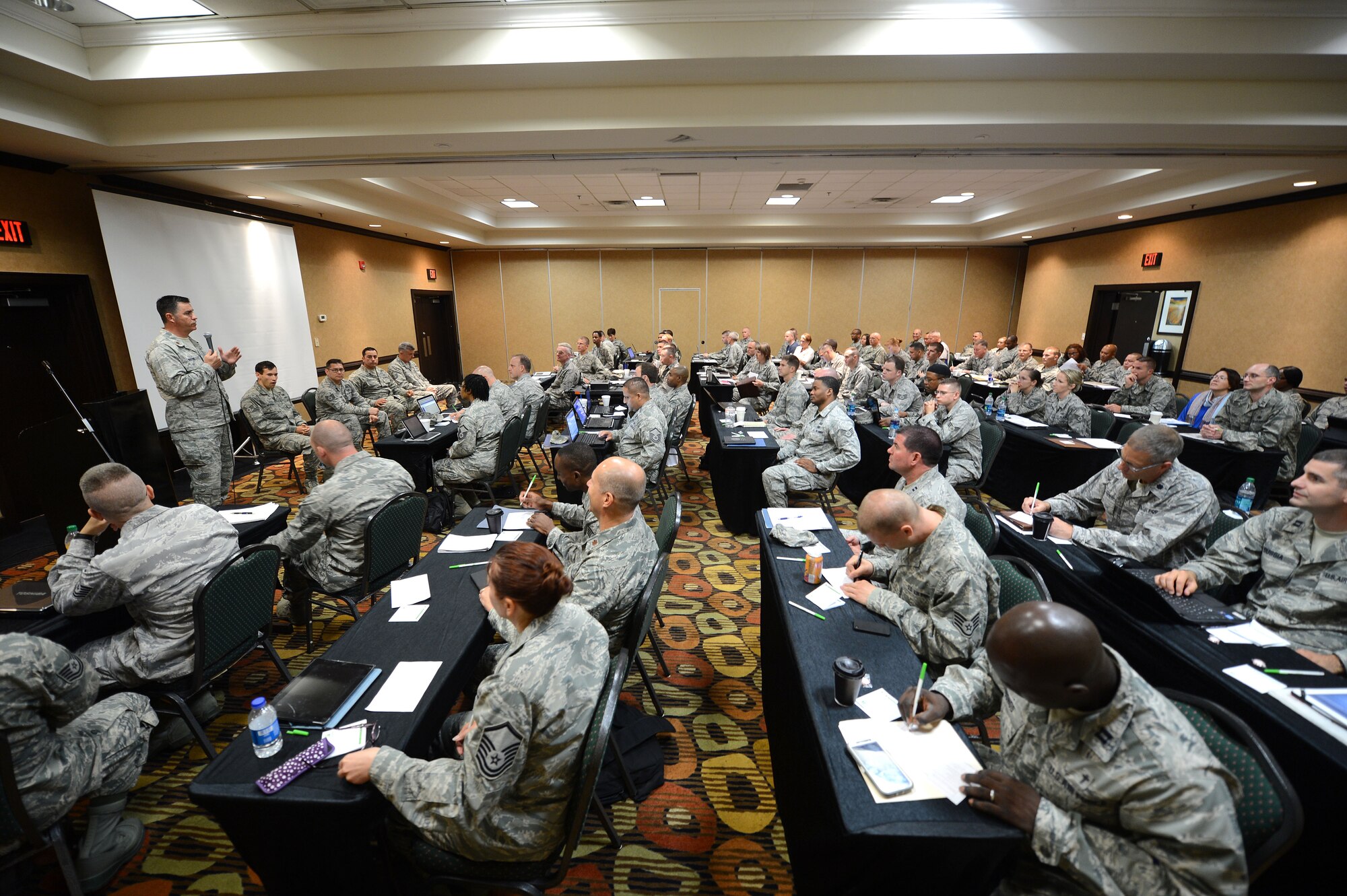 U.S. Air Force chaplains and chaplain assistants gathered for a symposium at the Holiday Inn, Columbia, S.C., June 18, 2013.  They discussed how to prepare to meet the spiritual needs of Airmen and other service members down range.  Four Airmen from the 20th Civil Engineer Squadron explosive ordnance disposal at Shaw spoke at the symposium about combat deployments and the vital role that chaplains had played for them.  (U.S. Air Force photo by Airman Nicole Sikorski/Released)