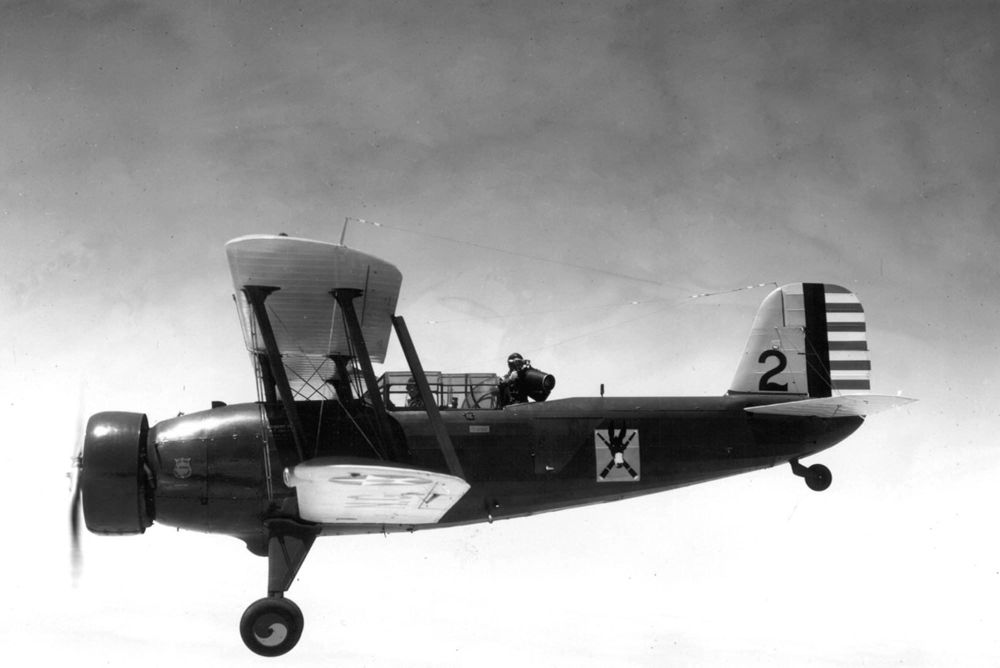 Members of the 110th Observation Squadron, Missouri National Guard, fly a Douglas O-38E observation plan with pilot and photographer onboard, circa 1936.  The photographer is using a K-17 Observation camera.  (131st Bomb Wing file photo/RELEASED)