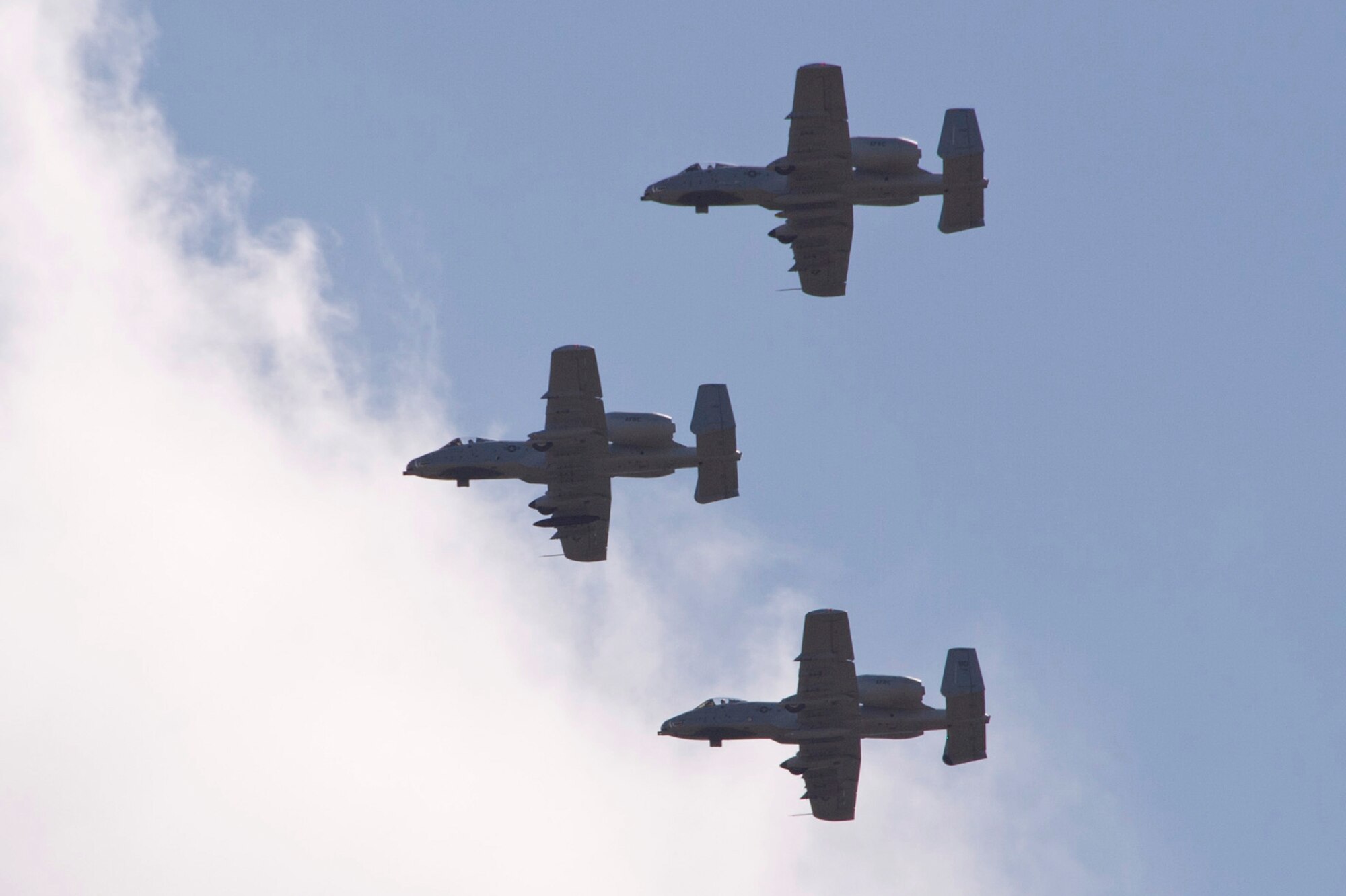 The last three A-10 Thunderbolts to be transferred From Barksdale Air Force Base, La., make a final pass over the Barksdale runway, June 24, 2013. Approximately 200 people gathered on the flight line to watch the sendoff. The transfer of the A-10s from Barksdale is due to the recent Force Structure Action Implementation Plan that dictates the 917th Fighter Group at Barksdale will be inactivated this year on the last day of September. These three A-10s are being transferred to Davis-Monthan Air Force Base, Ariz. (U.S. Air Force photo by Master Sgt. Jeff Walston/Released)
