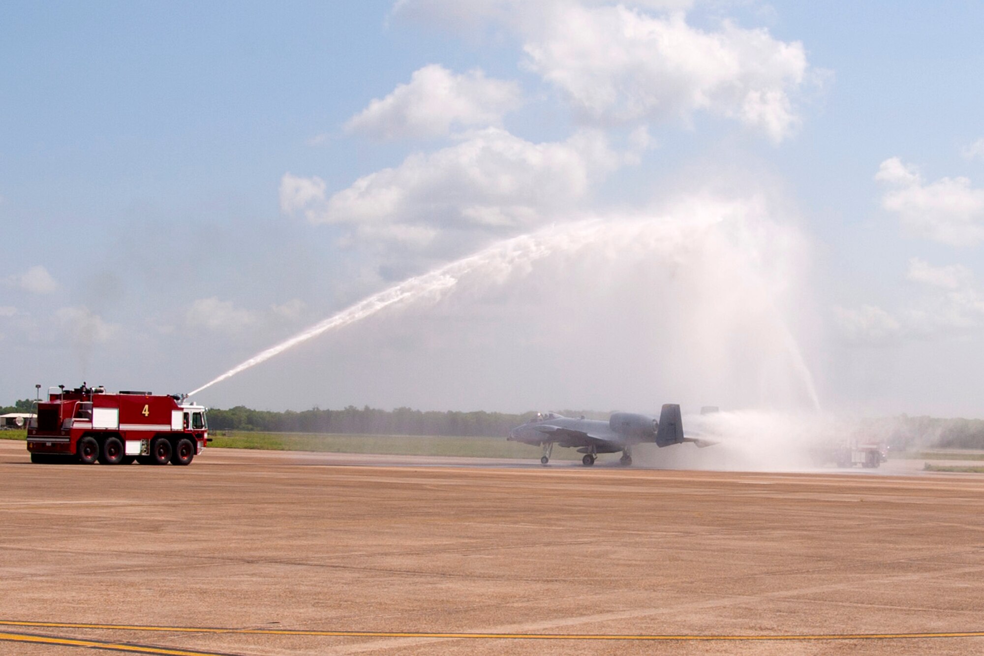 Maj. Mark Wendrock, who is a pilot assigned to the 47th Fighter Squadron, taxis his A-10 Thunderbolt II through a water salute after a short ceremony marking the departure of the last three A-10 Thunderbolt II jet aircraft from Barksdale Air Force Base, La., June 24, 2013.  Wendrock is piloting one of the last three A-10s being transferred to Davis-Monthan Air Force Base, Ariz. Approximately 200 people gathered on the flight line to watch the sendoff. The transfer of the A-10s from Barksdale is due to the recent Force Structure Action Implementation Plan that dictates the 917th Fighter Group at Barksdale will be inactivated this year on the last day of September. (U.S. Air Force photo by Master Sgt. Jeff Walston/Released)