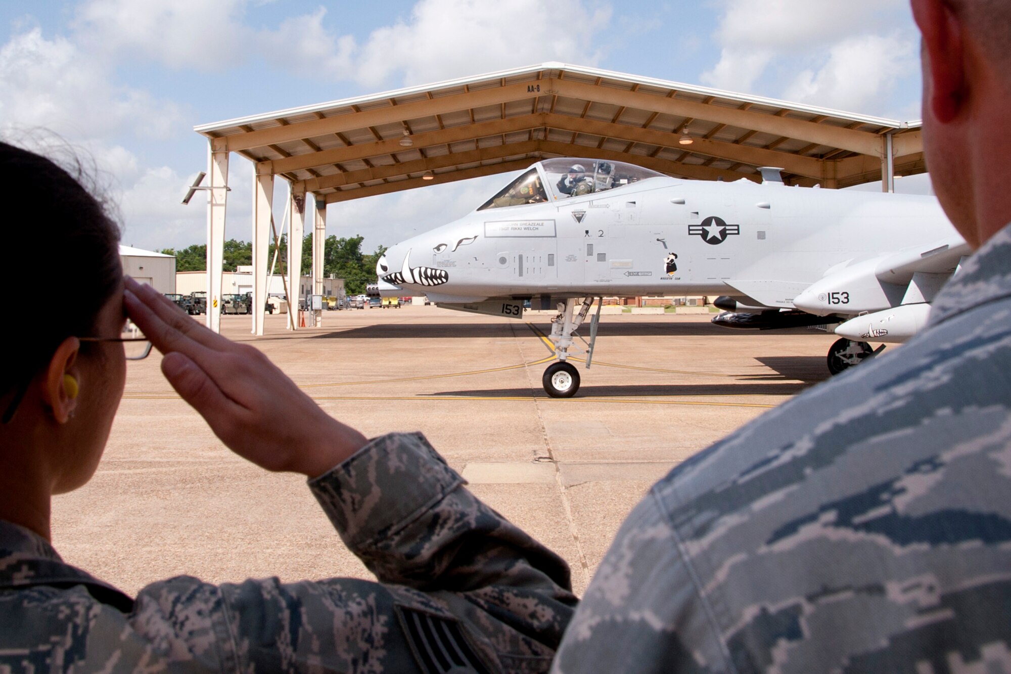 Col. John Breazeale, commander, 917th Fighter Group, salutes a line of Airmen as he taxis to the runway for his last takeoff in an A-10 Thunderbolt II from Barksdale Air Force Base, La., June 24, 2013. Breazeale is piloting the flagship of the 917 FG, which is one of the last three A-10s to leave Barksdale for Davis-Monthan Air Force Base, Ariz. Approximately 200 people gathered on the flight line to watch the sendoff. The transfer of the A-10s from Barksdale is due to the recent Force Structure Action Implementation Plan that dictates the 917 FG will be inactivated this year on the last day of September. (U.S. Air Force photo by Master Sgt. Jeff Walston/Released)