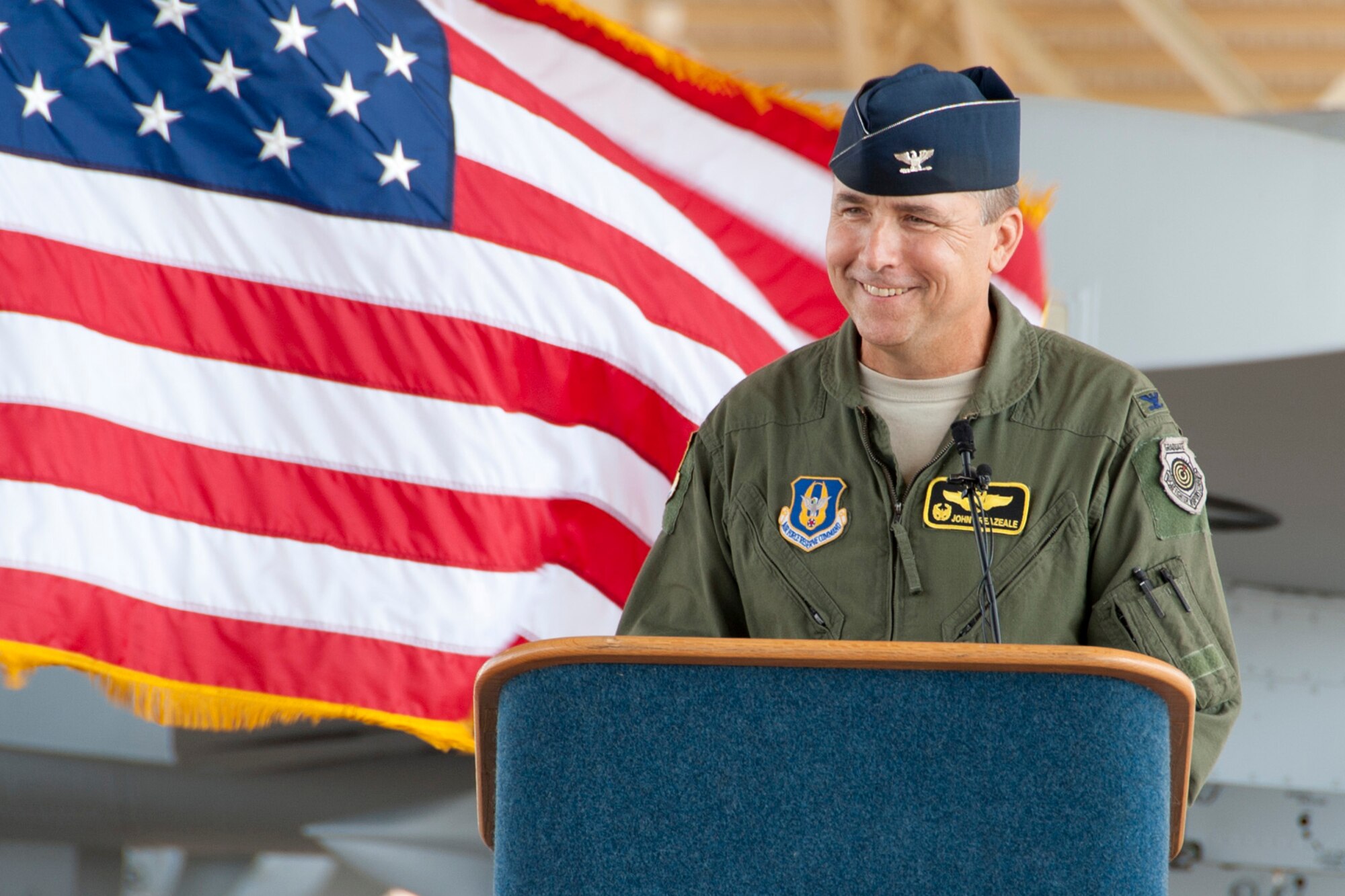 Col. John Breazeale, commander, 917th Fighter Group, speaks to a crowd of about 200 during a ceremony marking the departure of the last A-10 Thunderbolt II jet aircraft from Barksdale Air Force Base, La., June 24, 2013. Breazeale is piloting the flagship of the 917 FG, which is one of the last three A-10s to leave Barksdale for Davis-Monthan Air Force Base, Ariz. Approximately 200 people gathered on the flight line to watch the sendoff. The transfer of the A-10s from Barksdale is due to the recent Force Structure Action Implementation Plan that dictates the 917 FG will be inactivated this year on the last day of September. (U.S. Air Force photo by Master Sgt. Jeff Walston/Released) 