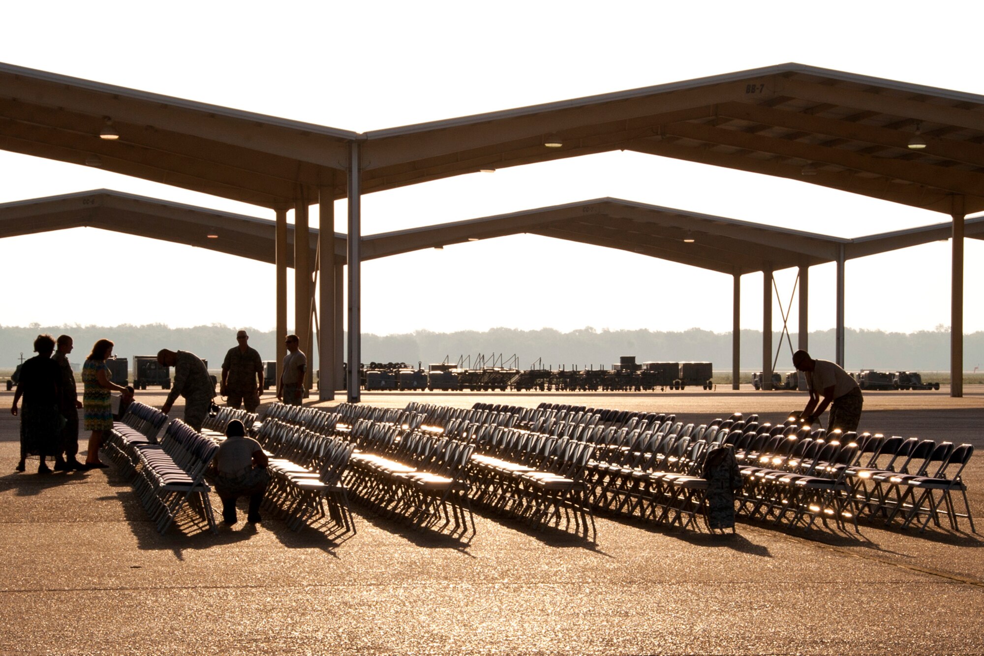 Volunteers set up for the ceremony marking the departure of the last A-10 Thunderbolt II jet aircraft from Barksdale Air Force Base, La., June 24, 2013. The transfer of all the A-10s from Barksdale is due to the recent Force Structure Action Implementation Plan that dictates the 917th Fighter Group will be inactivated this year on the last day of September. (U.S. Air Force photo by Master Sgt. Jeff Walston/Released) 