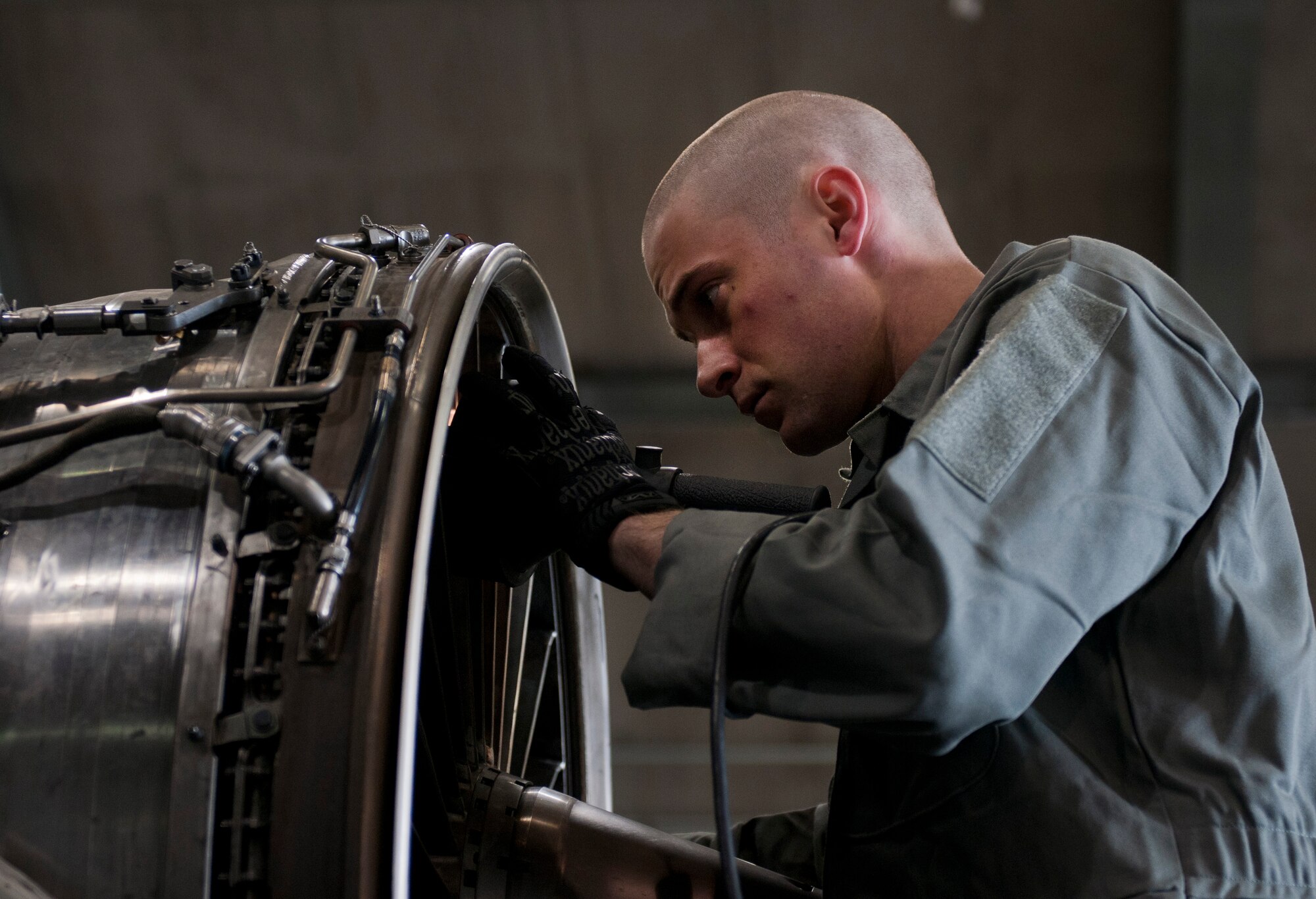 U.S. Air Force Staff Sgt. James Root, 366th Component Maintenance Squadron aerospace propulsion journeyman, looks at engine blades, May 5, 2013, at Mountain Home Air Force Base, Idaho. The blades must be checked prior to an engine test run and again when the run is complete. (U.S. Air Force photo by Senior Airman Heather Hayward/Released)