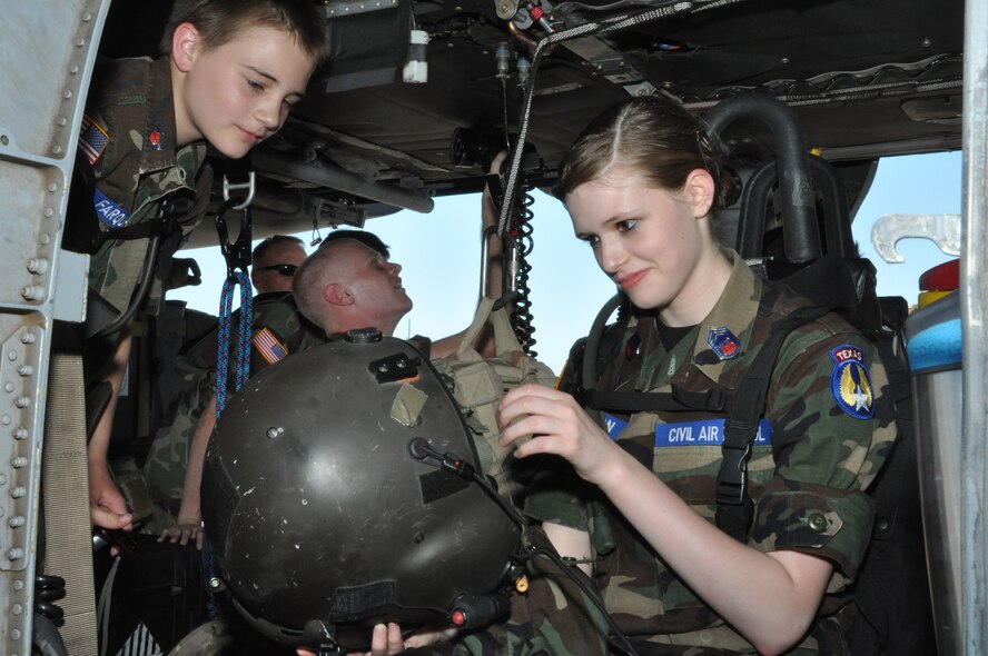 More than a dozen middle school and high school-aged civil air patrol students were treated to a tour of the 305th Rescue Squadron's HH-60 Pave Hawk helicopter June 13 at the Naval Air Station Fort Worth Joint Reserve Base, Texas. They were shown all the aminties that this metal giant has to offer to assist the aircrews in their search and rescue missions. (U.S. Air Force photo/Master Sgt. Julie Briden-Garcia)