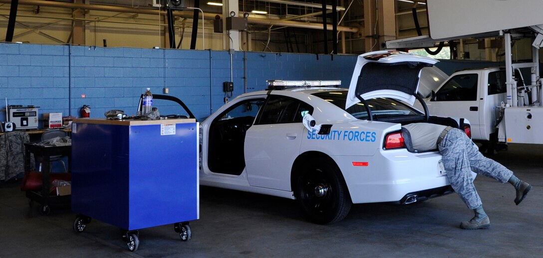 Senior Airman Christian Chavez, 11th Logistics Readiness Squadron vehicle maintainer, installs an Automated Information Module 2 (AIM2) fuel sensing ring at Joint Base Andrews, Md., May 17, 2013.  Maintainers have installed the system on more than 500 vehicles since October 2012. (U.S. Air Force photo/Airman 1st Class Nesha Humes)