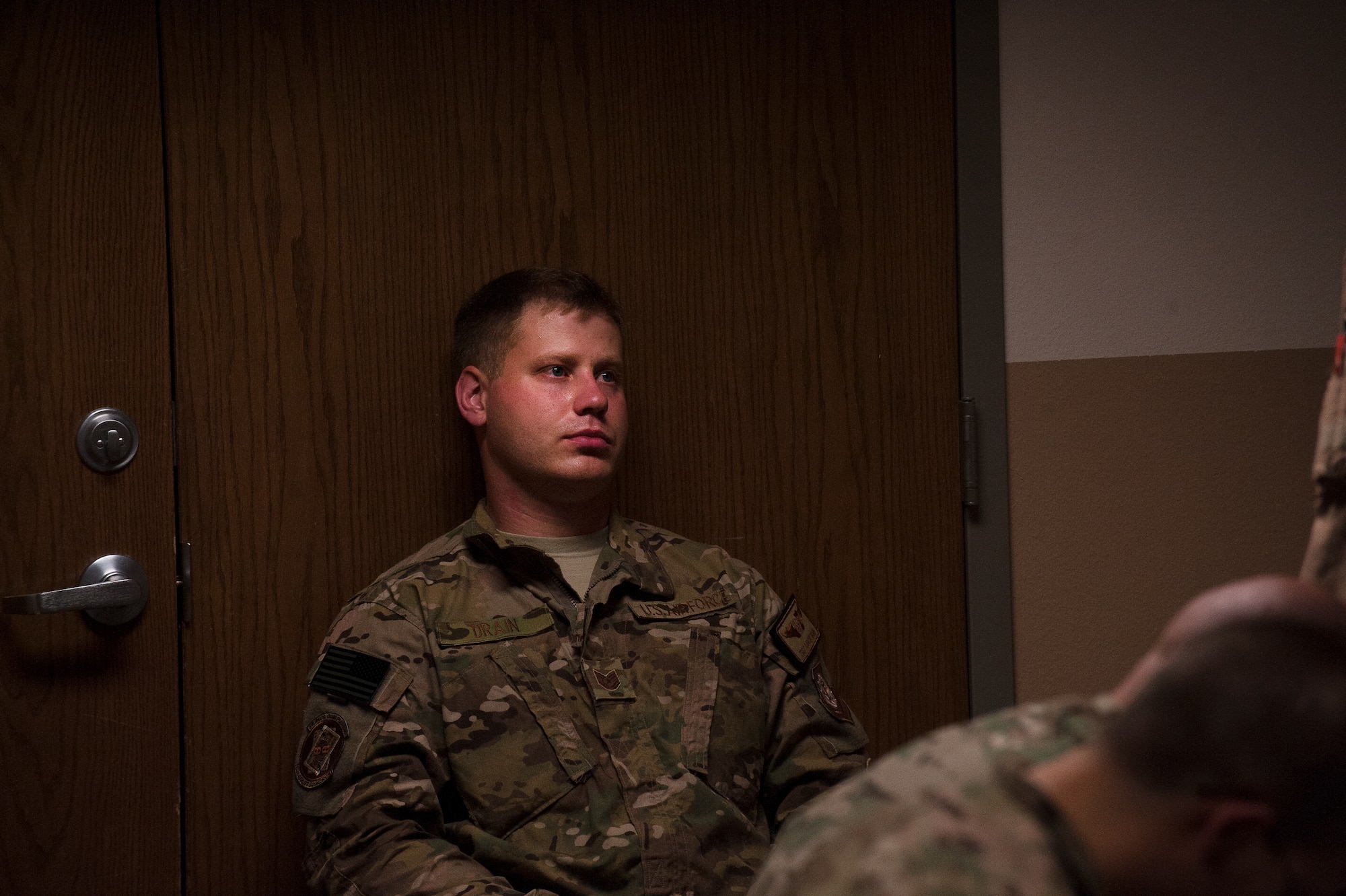 Tech. Sgt. Aaron Drain sits alone Sept. 5, 2012, in the Little Rock Air Force Base passenger terminal, Ark. This is where Little Rock Airmen spend their last few hours before deploying. (U.S. Air Force photo by Staff Sgt. Russ Scalf)