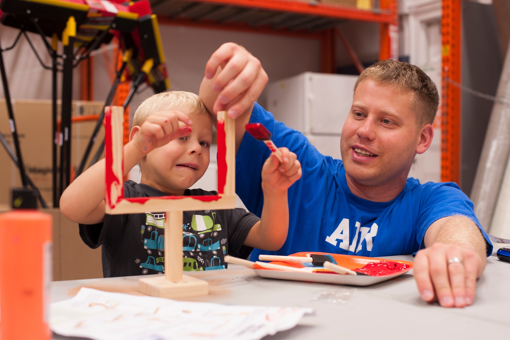 Tech. Sgt. Aaron Drain works on a craft project with his son, Ayden, Sept. 1, 2012, in Cabot, Ark. In the days leading up to his deployment, Drain spent most of his free time trying to strengthen the bonds between himself and his family. (U.S. Air Force photo by Staff Sgt. Russ Scalf)