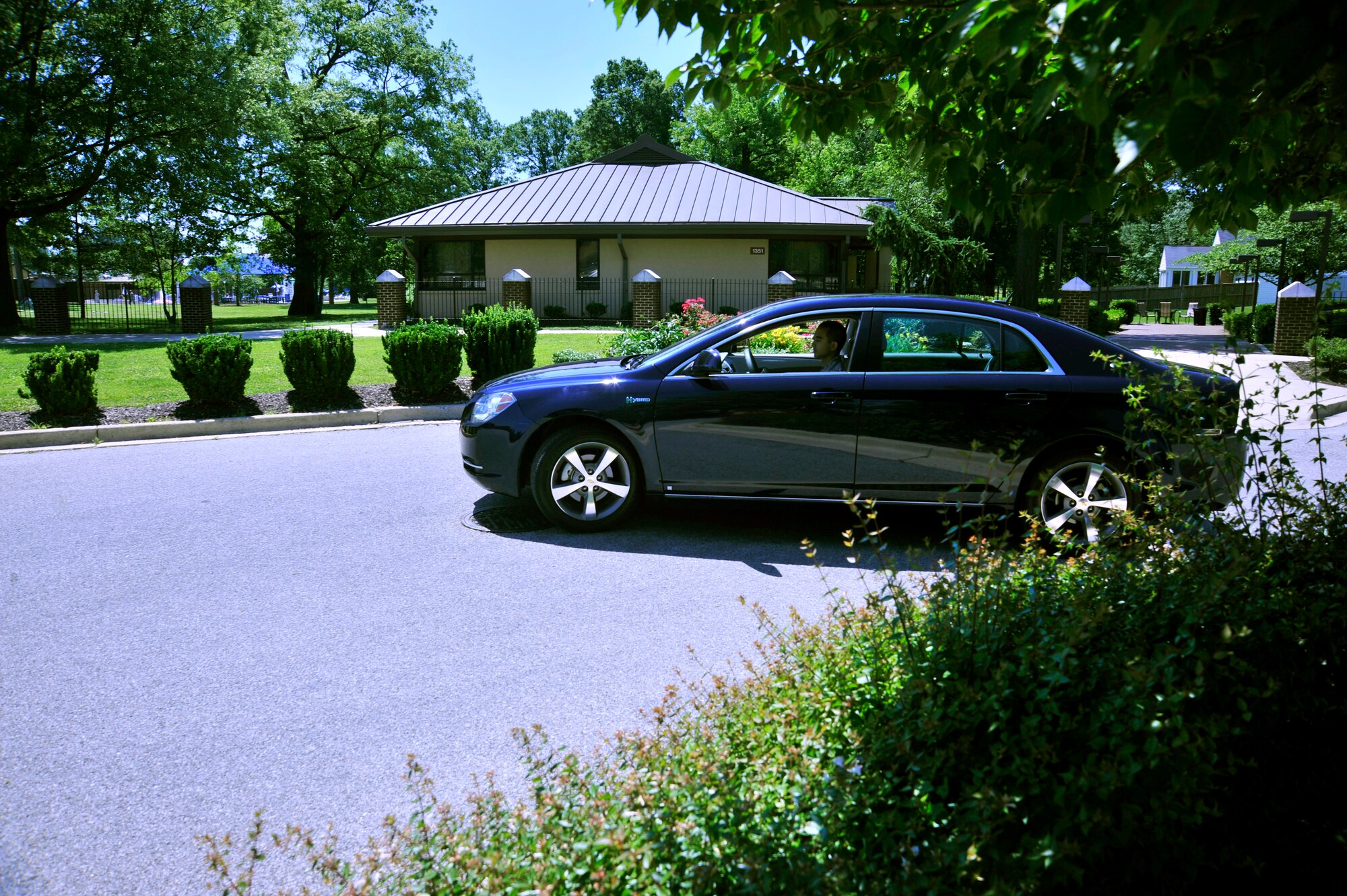 Staff Sgt. Calvin Collosi, 11th Logistic Readiness Squadron Protocol Service vehicle dispatcher, transports a distinguished visitor car to the east side of Joint  Base Andrews on June 21, 2013. The National Capital Region averages 1,500 distinguished visitor requests annually. (U.S. Air Force photo/ Staff Sgt. Amber Russell) 