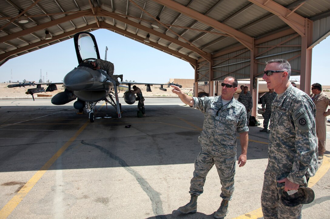 Chief Timothy Keating, from the 140th Wing, Colorado Air National Guard, explains maintenance operations to Maj. Gen. Gary Cheek, deputy command general at Army Central Command during his visit to a training base in Northern Jordan as part of Exercise Eager Lion. Eager Lion is a U.S. Central Command-directed, irregular warfare-themed exercise focusing on missions the United States and its coalition partners might perform in support of global contingency operations. (U.S. Air National Guard photo by Senior Master Sgt. John P. Rohrer)
