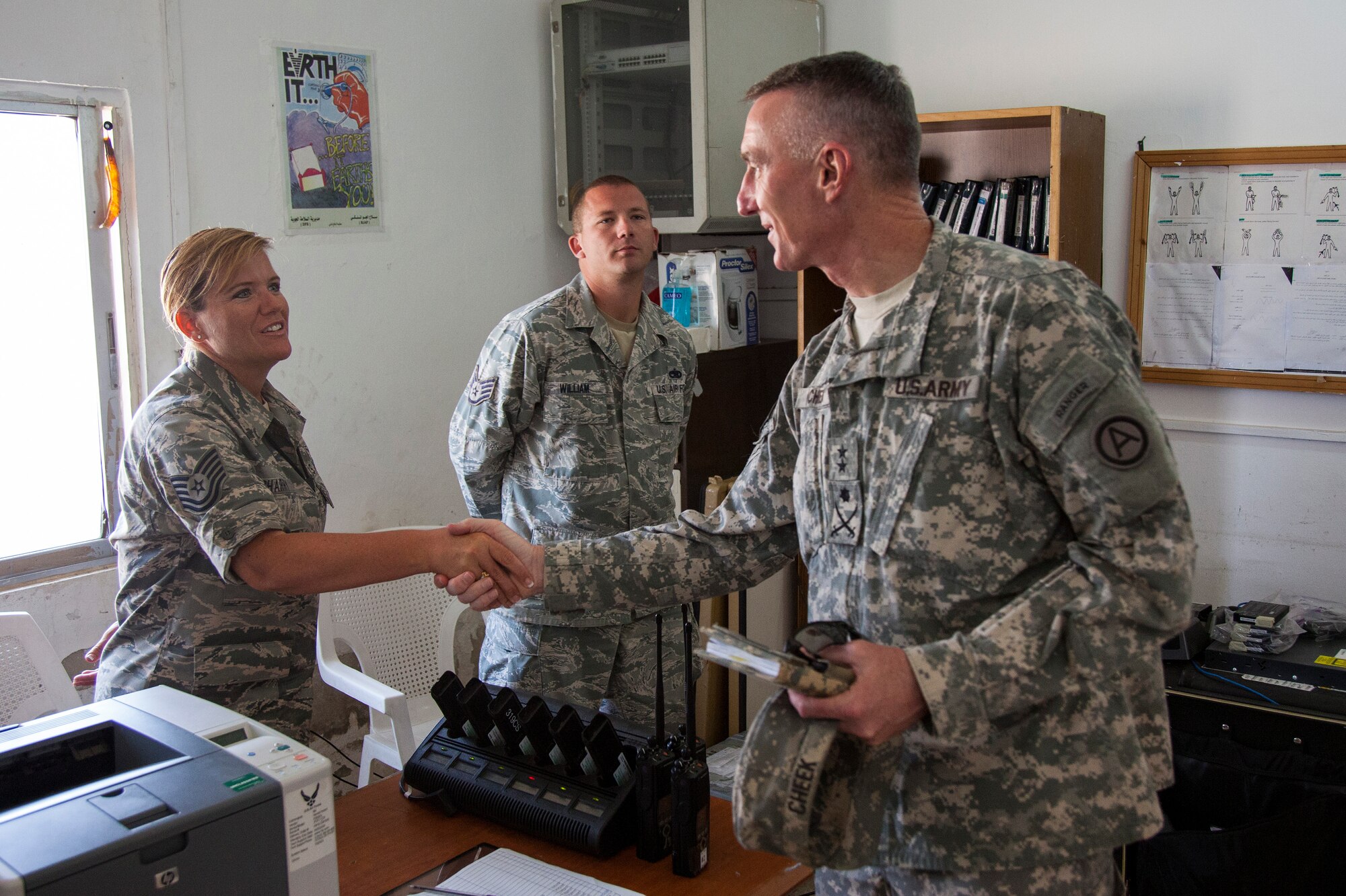 Major Gen. Gary Cheek, deputy command general at Army Central Command greets Tech Sgt. Michele Charry from the 140th Wing, Colorado Air National Guard, during his visit to a training base in Northern Jordan during exercise Eager Lion. Eager Lion is a U.S. Central Command-directed, irregular warfare-themed exercise focusing on missions the United States and its coalition partners might perform in support of global contingency operations. (U.S. Air National Guard photo by Senior Master Sgt. John P. Rohrer)