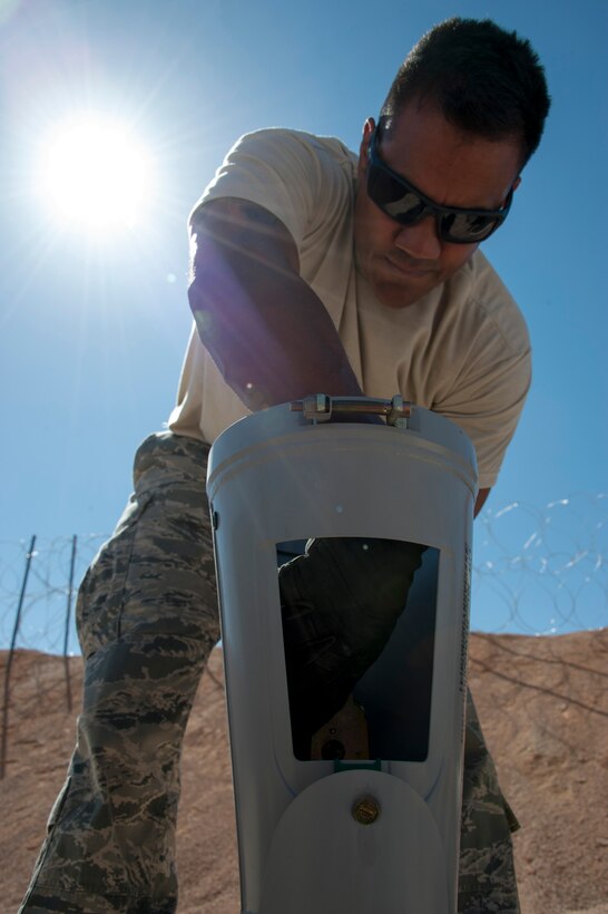 Senior Airman Alexis Isaac, a munitions specialist with the 140th Wing, Colorado Air National Guard, prepares the fin section of a MK-82 bomb that will be used in a bombing demonstration at a training base in Northern Jordan as part of Exercise Eager Lion. Eager Lion is a U.S. Central Command-directed, irregular warfare-themed exercise focusing on missions the United States and its coalition partners might perform in support of global contingency operations.  (U.S. Air National Guard photo by Senior Master Sgt. John P. Rohrer)