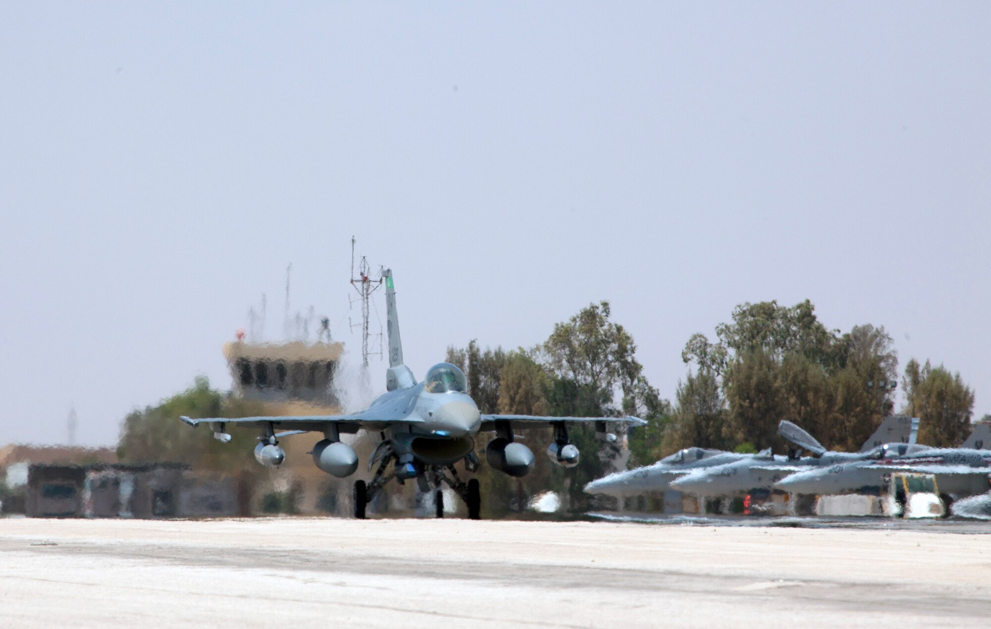An F-16 Fighting Falcon from the 180th Fighter Wing, Ohio Air National Guard, taxis after arriving at a training base in Northern Jordan as part of Exercise Eager Lion. Eager Lion is a U.S. Central Command-directed, irregular warfare-themed exercise focusing on missions the United States and its coalition partners might perform in support of global contingency operations. (U.S. Air National Guard photo by Senior Master Sgt. John P. Rohrer)