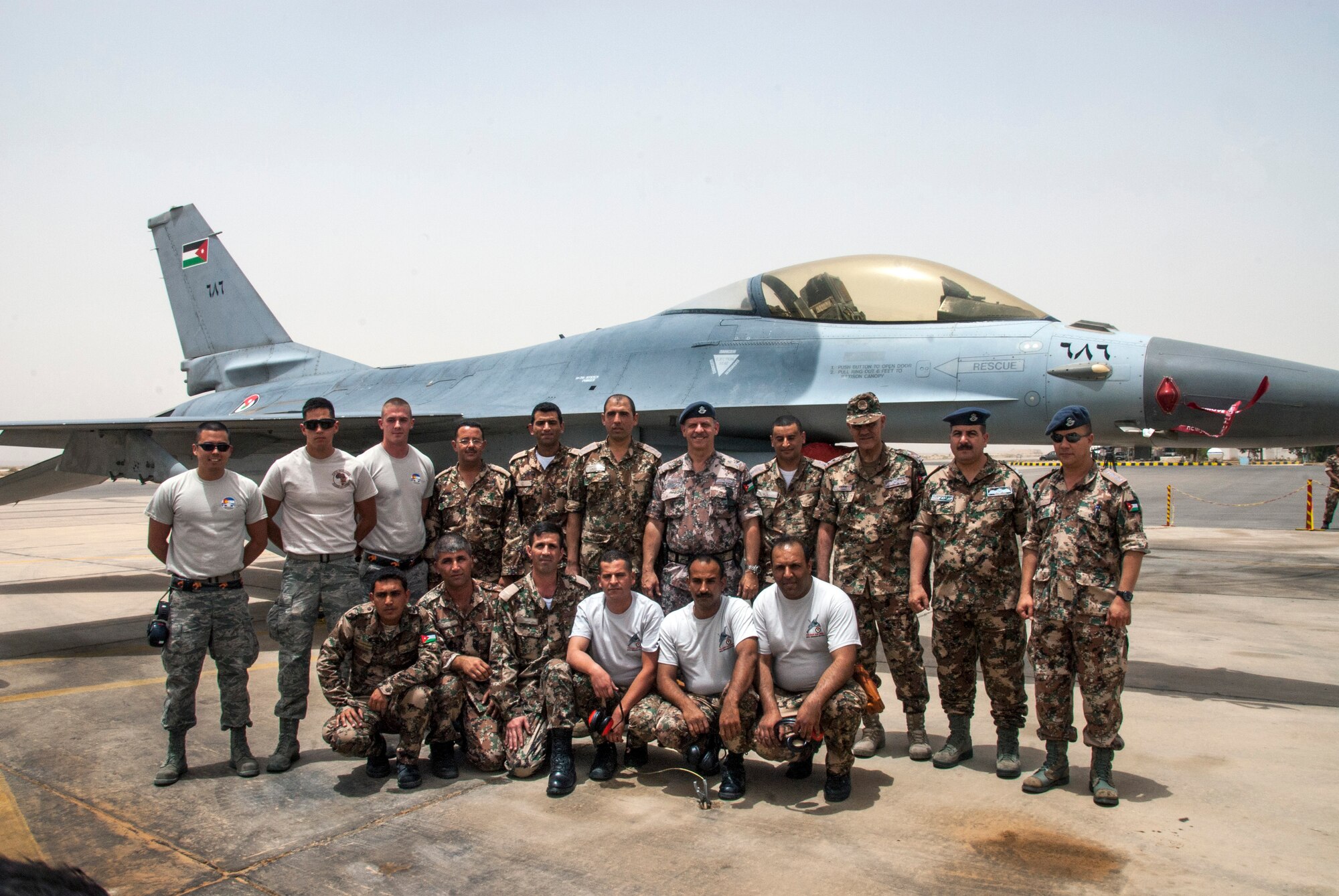 The Prince of Jordan, HRH Feisal bin Hussein (center with beret), poses with members from the Colorado and Jordan armed forces during an Eager Lion munitions loading event at a training base in Northern Jordan. Eager Lion is a U.S. Central Command-directed, irregular warfare-themed exercise focusing on missions the United States and its coalition partners might perform in support of global contingency operations. (U.S. Air National Guard photo by Senior Master Sgt. John P. Rohrer)
