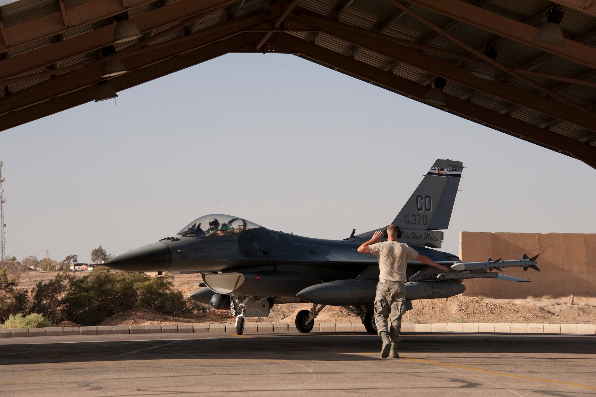 An F-16 Fighting Falcon from the Colorado Air National Guard prepares to park at a training base in Northern Jordan as part of the Eager Lion exercise. Eager Lion is a U.S. Central Command-directed, irregular warfare-themed exercise focusing on missions the United States and its coalition partners might perform in support of global contingency operations. (U.S. Air National Guard photo by Senior Master Sgt. John P. Rohrer)