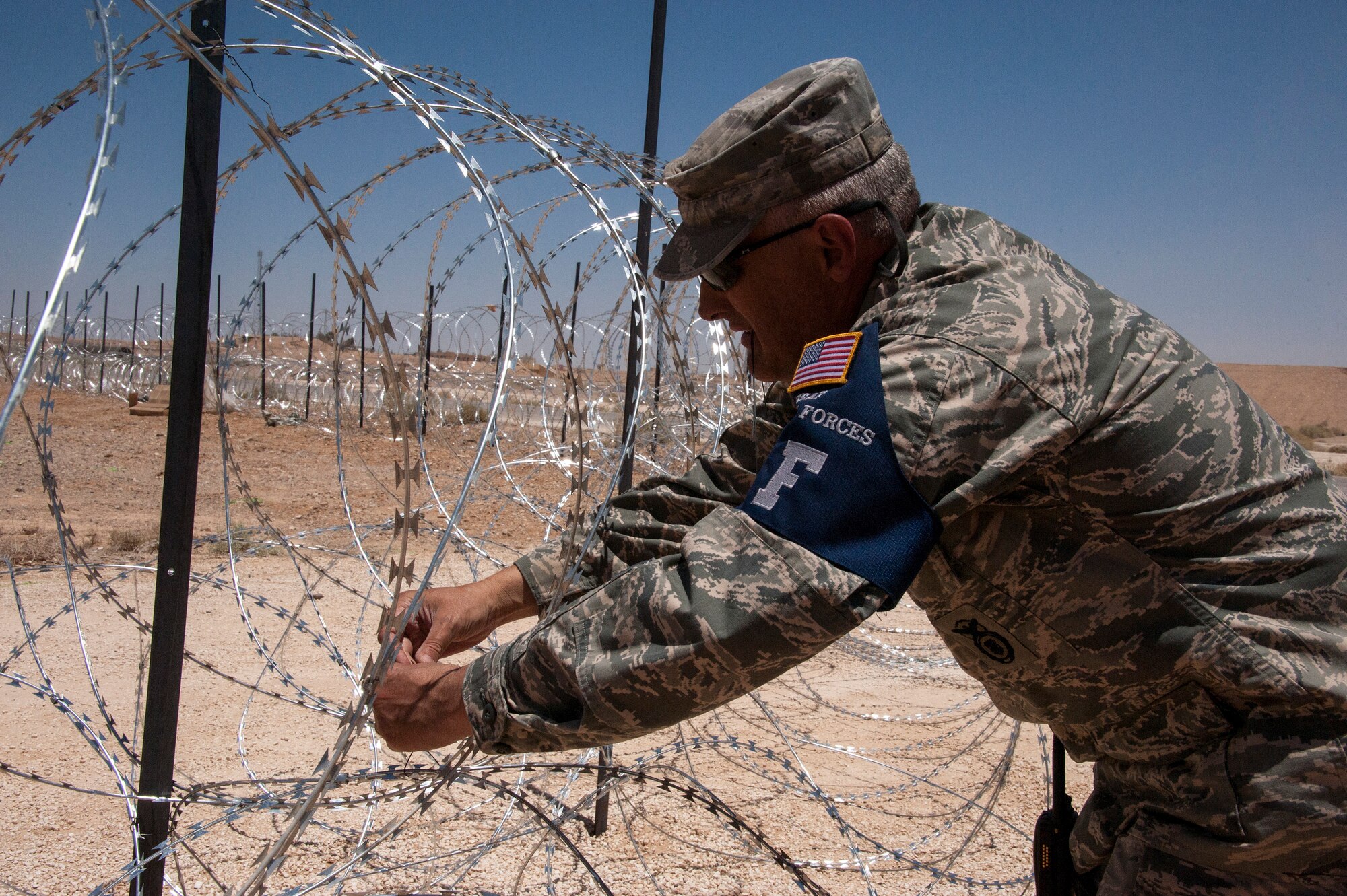 Senior Master Sgt. John Schmidt from the 140th Wing, Colorado Air National, installs Constantine for a defensive perimeter at a training base in Northern Jordan as part of the Eager Lion exercise. Eager Lion is a U.S. Central Command-directed, irregular warfare-themed exercise focusing on missions the United States and its coalition partners might perform in support of global contingency operations. (U.S. Air National Guard photo by Senior Master Sgt. John P. Rohrer)