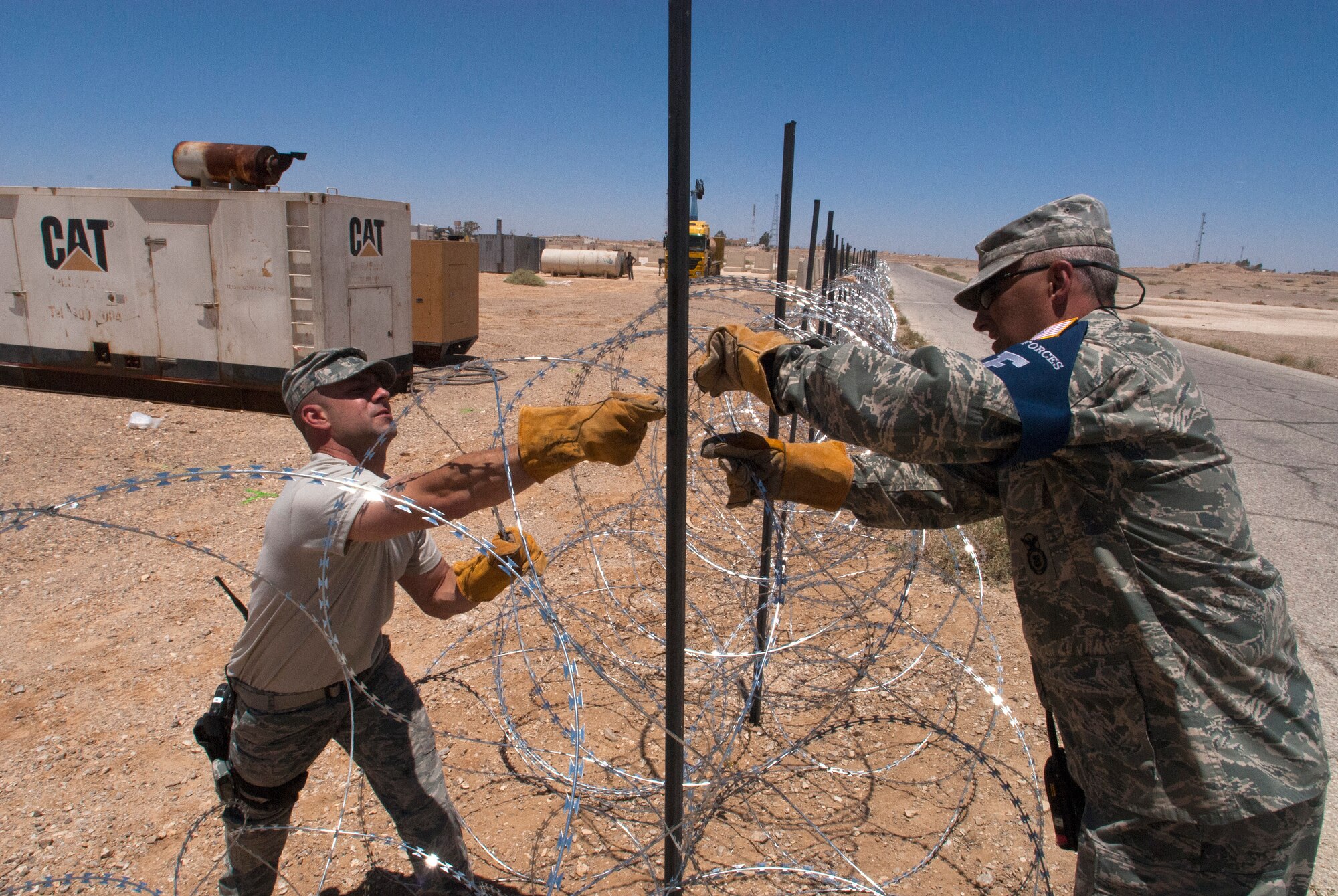 Senior Master Sgt. John Schmidt from the 140th Wing, Colorado Air National Guard (right), and Master Sgt. AJ Schettino from the McGuire Air National Guard, New Jersey, install Constantine for a defensive perimeter at a training base in Northern Jordan as part of the Eager Lion exercise. Eager Lion is a U.S. Central Command-directed, irregular warfare-themed exercise focusing on missions the United States and its coalition partners might perform in support of global contingency operations.(U.S. Air National Guard photo by Senior Master Sgt. John P. Rohrer)