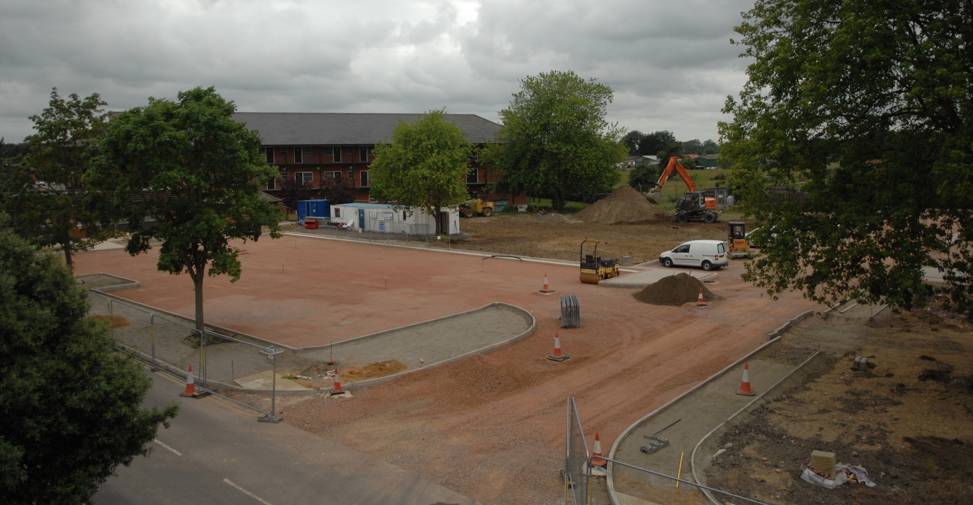 A parking lot behind the base laundromat awaits pavement June 24, 2013, on RAF Mildenhall, England. The parking lot is slated for completion in early July. With the addition of the lot, the laundromat will be able to accommodate more customers, as well as make it easier for customers to transport laundry to and from the laundromat. (U.S. Air Force photo by Airman 1st Class Dillon Johnston/Released)