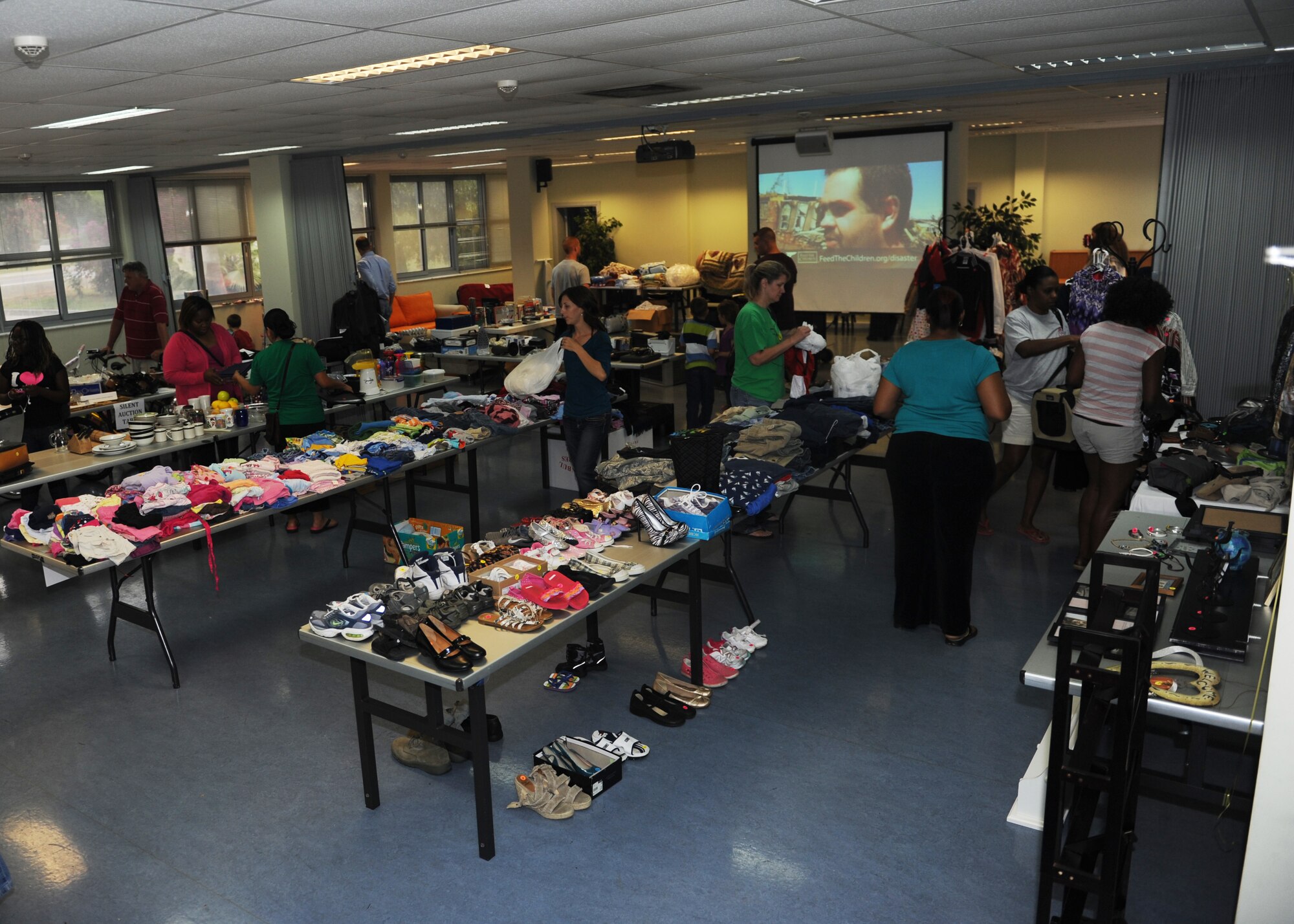 Shoppers peruse the hundreds of donated items for sale at the Rummage for Relief fundraiser June 8, 2013 at Incirlik Air Base, Turkey. All proceeds from the sale went to a disaster relief organization. (U.S. Air Force photo by Senior Airman Chase Hedrick/Released)
