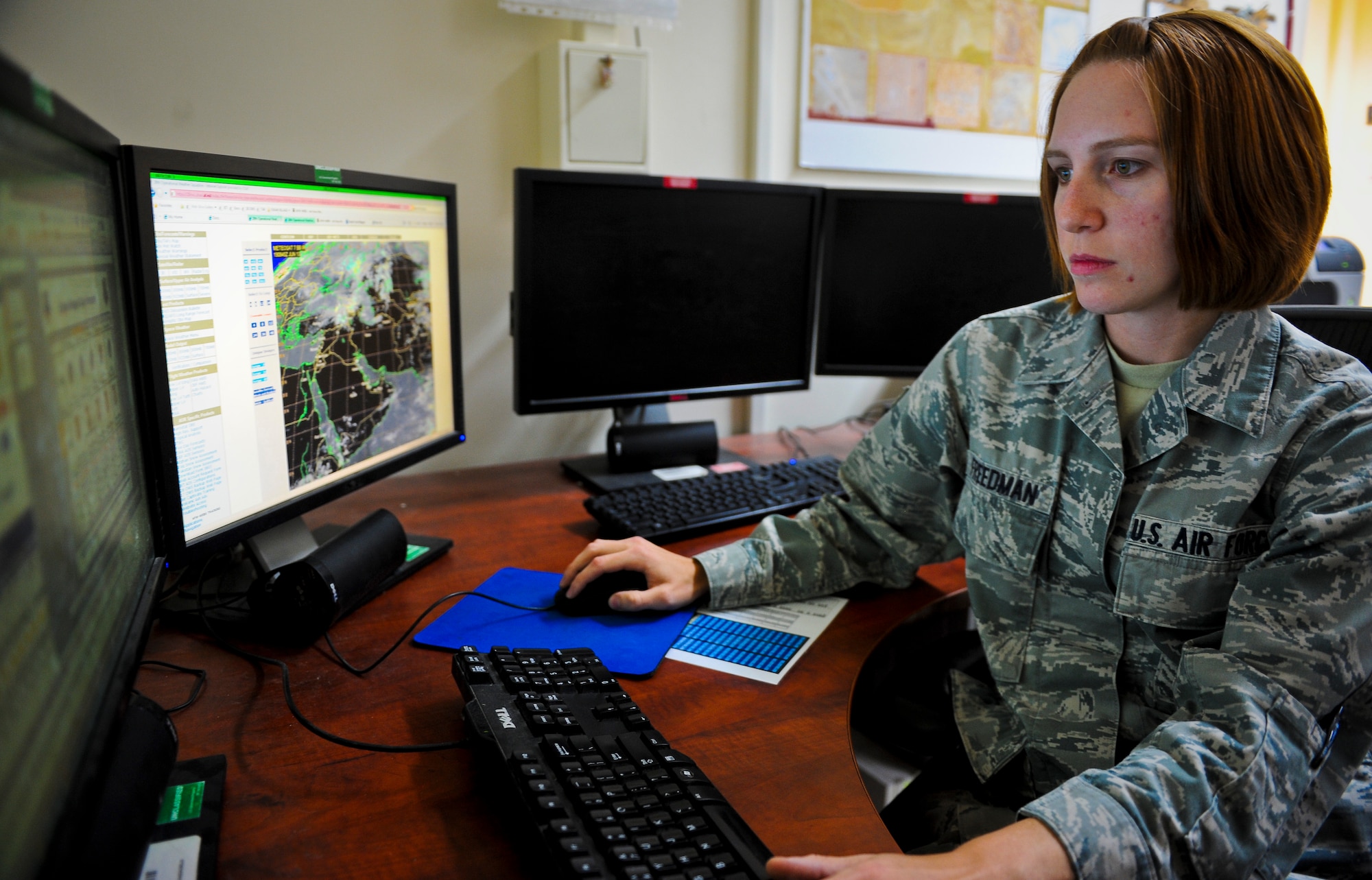 Senior Airman Alicia Freedman analyzes weather data as she prepares a forecast briefing for base leadership at the 379th Air Expeditionary Wing in Southwest Asia, June 19, 2013. Freedman is a 379th Expeditionary Operations Support Squadron weather forecaster deployed from Barksdale Air Force Base, La. (U.S. Air Force photo/Senior Airman Benjamin Stratton)