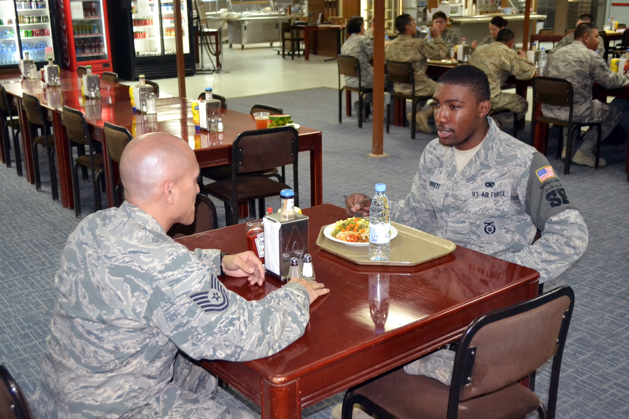 The 64th Air Expeditionary Group Focus 5/6 hosted a “Speed Mentoring” session at the Mirage dining facility, June 13, 2013, affording 17 junior and senior NCOs an opportunity to sit down with 30 Airmen during a one-on-one question and answer session. (U.S. Air Force photo)