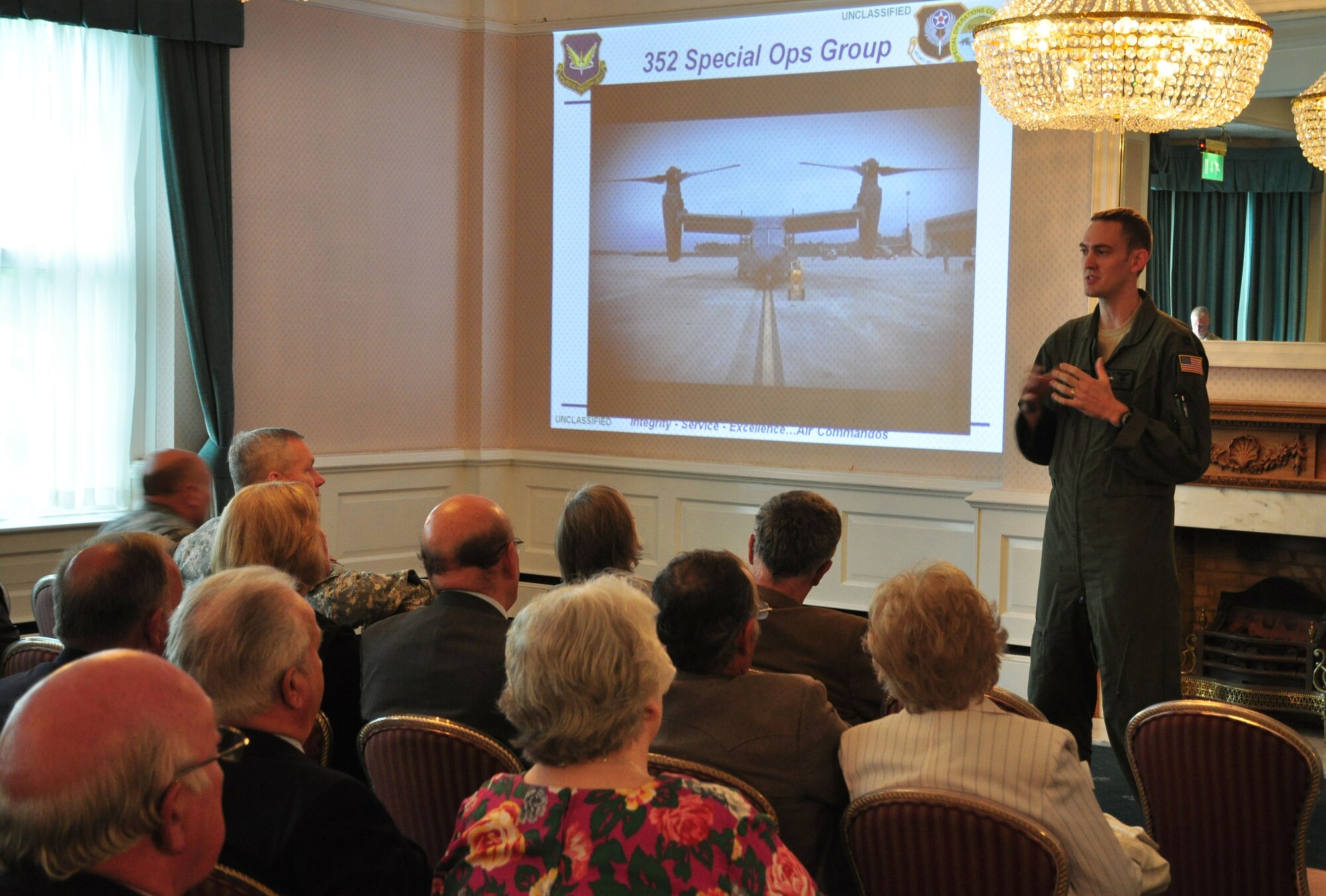 Capt. Jonathan Ball, 7th Special Operations Squadron chief of training, talks about the CV-22 Osprey during a civic leader visit June 21, 2013, on RAF Mildenhall, England. More than 60 community leaders, landowners and other distinguished visitors attended a joint 100th Air Refueling Wing and 352nd Special Operations Group civic leader event focused on showcasing the 352nd SOG and its ongoing expansion. (U.S. Air Force photo by Capt. Jason Smith/Released)