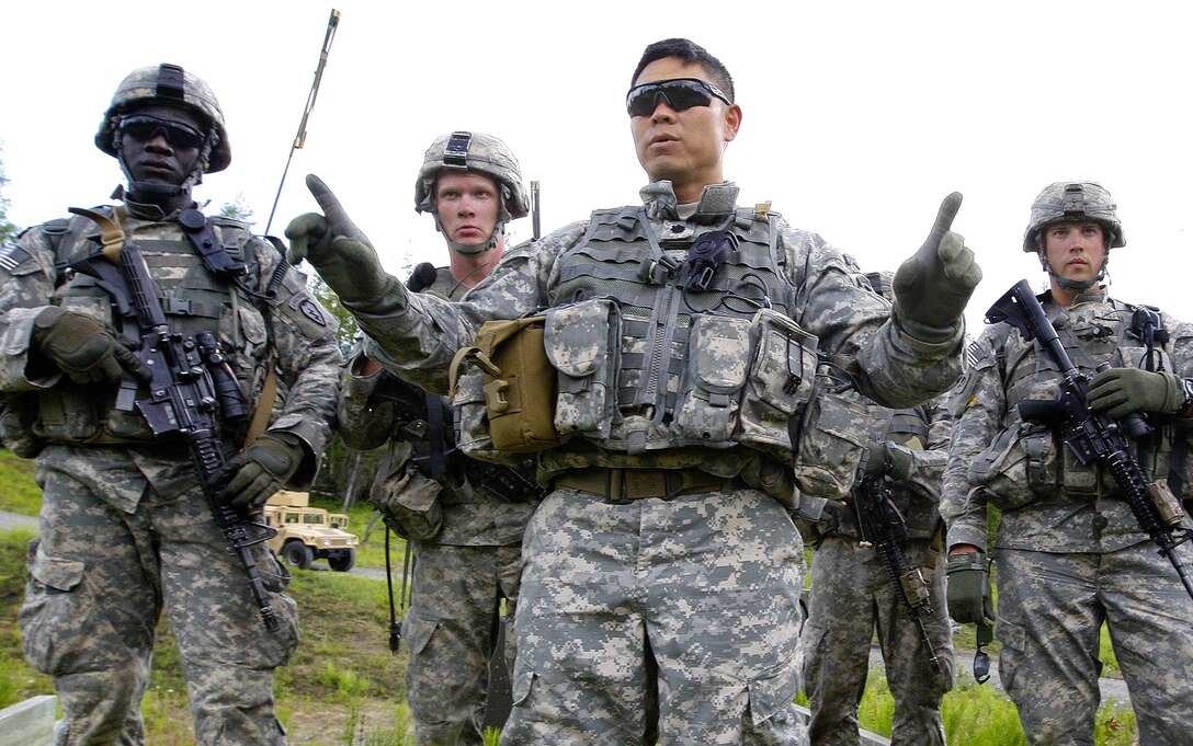 Army Lt. Col. Richard Scott, front, conducts an after-action review with his soldiers at the completion of a dismounted live-fire exercise at the Infantry Platoon Battle Course on Joint Base Elmendorf-Richardson, Alaska, June 19, 2013. Scott is commander of  1st Squadron, Airborne, 40th Cavalry Regiment.