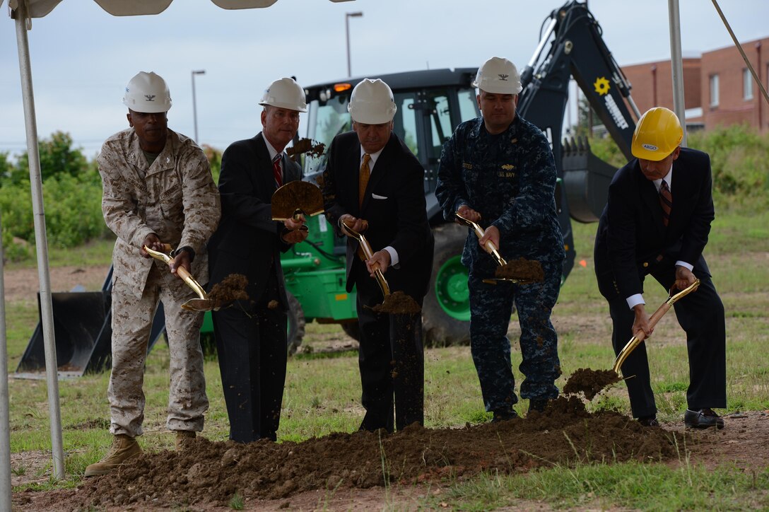 Key players break ground on the last phase of a three phase development for the Marine Corps Embassy Security Group compound on the west-side of Marine Corps Base Quantico on June 19, 2013.