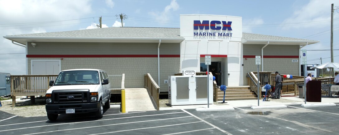 Marine Corps Community Services staff and held a ribbon cutting to commemorate the opening of the Onslow Beach Marine Mart aboard Marine Corps Base Camp Lejeune June 4. The new facility has been open several weeks and sees hundreds of beach-goers, averaging 500 to 700 patrons on the weekends.